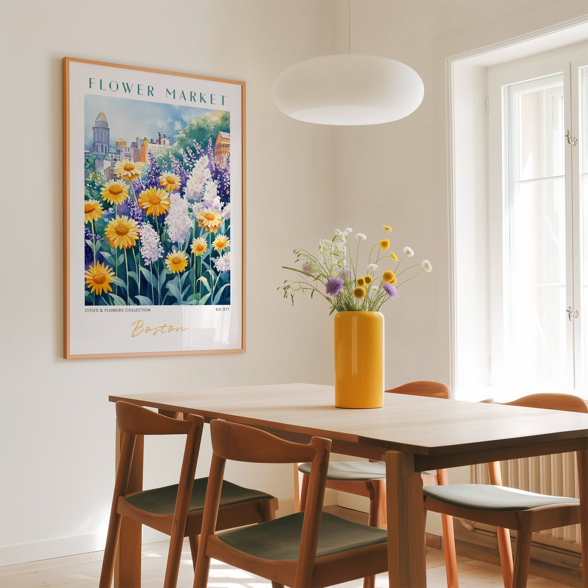 Boston flower market print in an oak frame above a dining table with a yellow vase and white pendant light