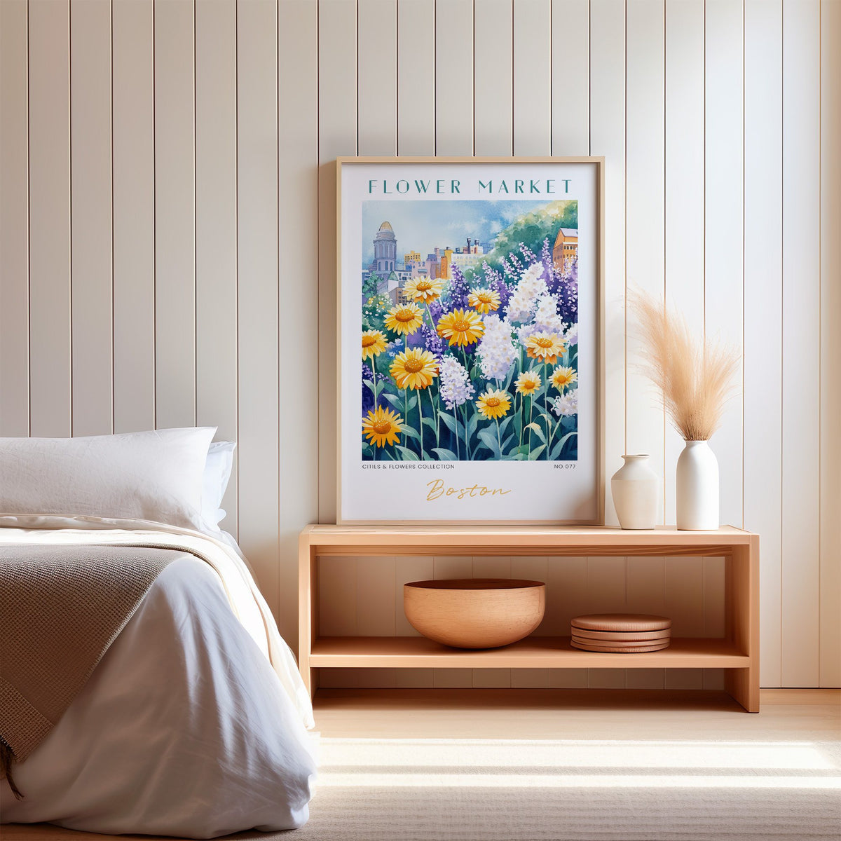 Boston flower market print in an oak frame on a wood bench against a white shiplap bedroom wall with pampas grass