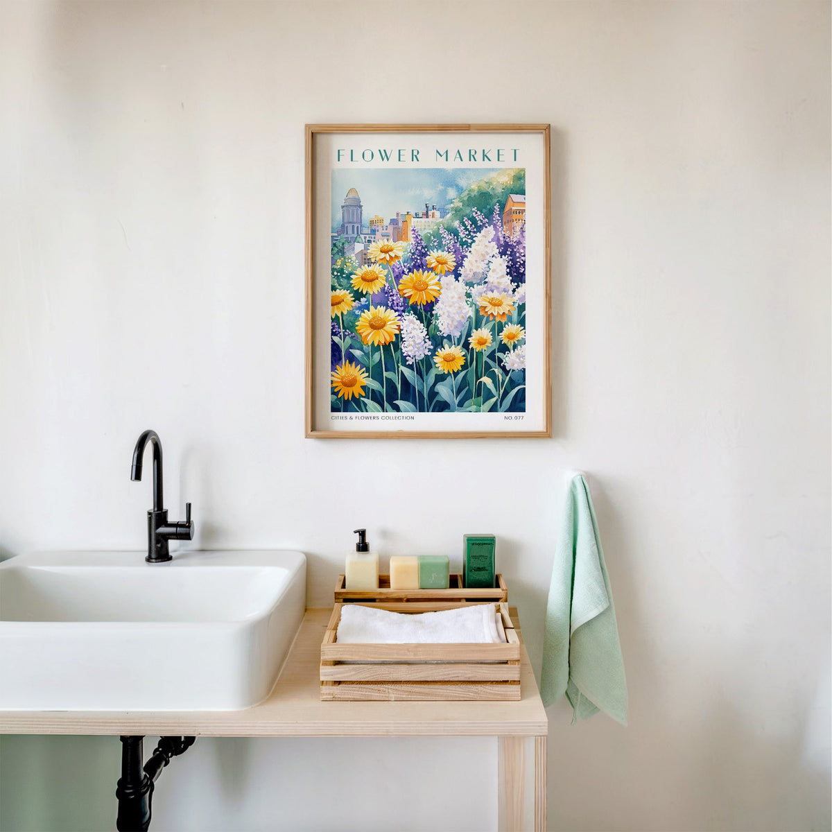 Boston flower market print in an oak frame above a white bathroom sink with folded towels