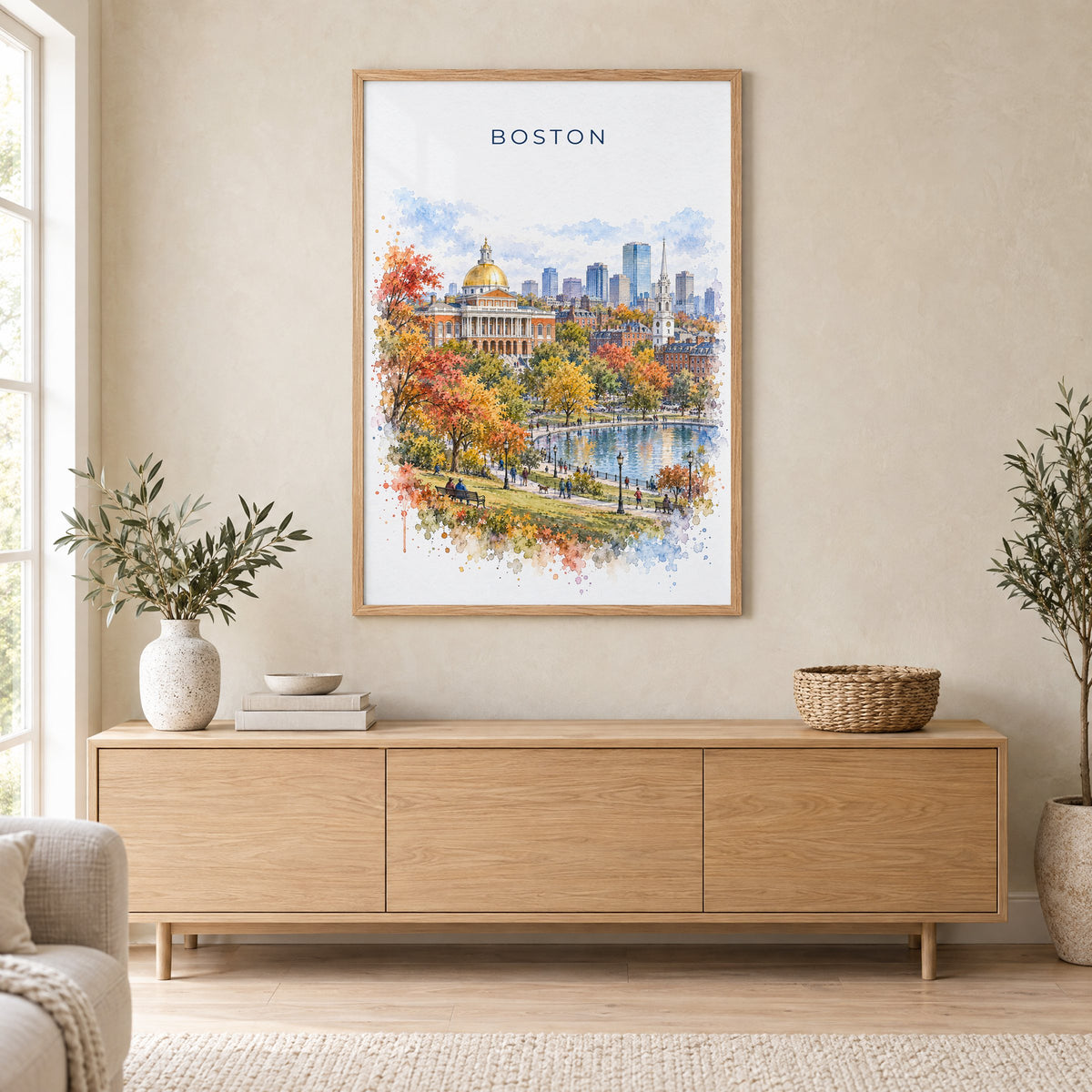 Boston watercolor print in an oak frame above a light wood sideboard in a Scandinavian living room