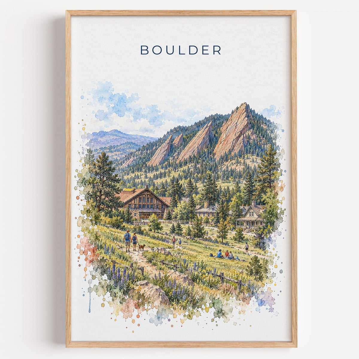 Boulder watercolor print in a light oak frame on a plain white wall