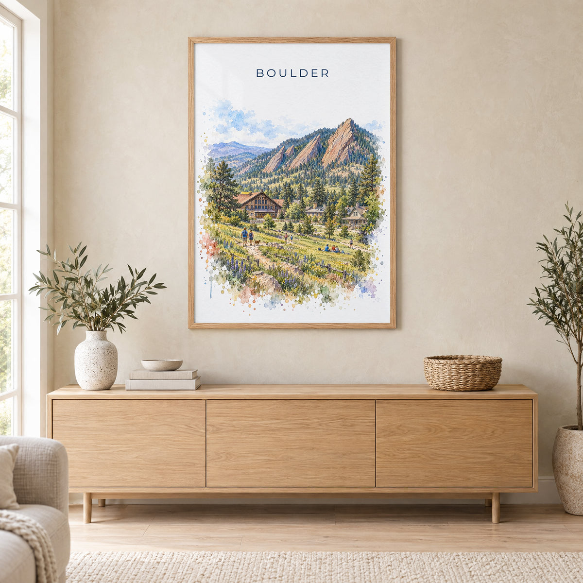 Boulder watercolor print in an oak frame above a light wood sideboard in a Scandinavian living room