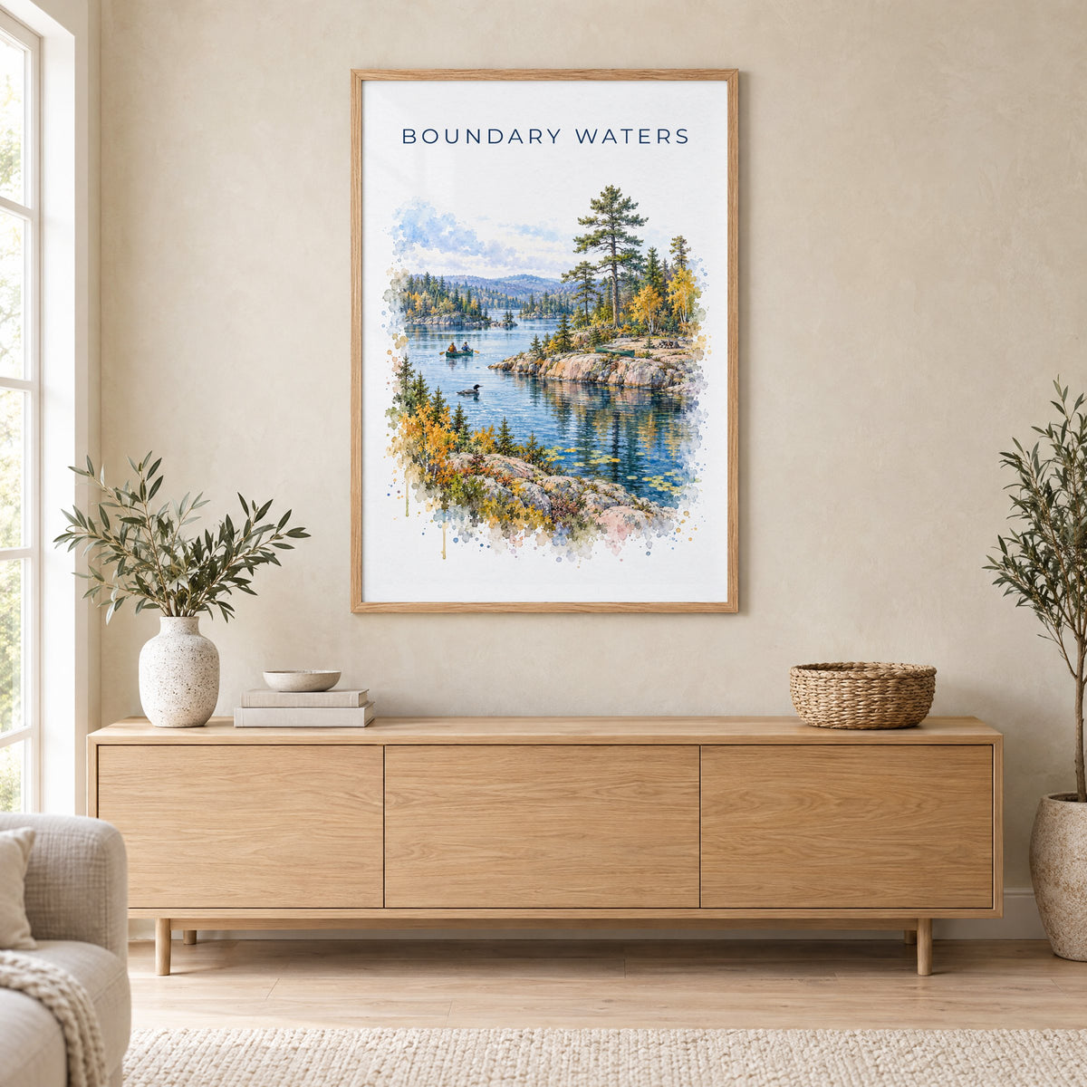 Boundary Waters watercolor print in an oak frame above a light wood sideboard in a Scandinavian living room