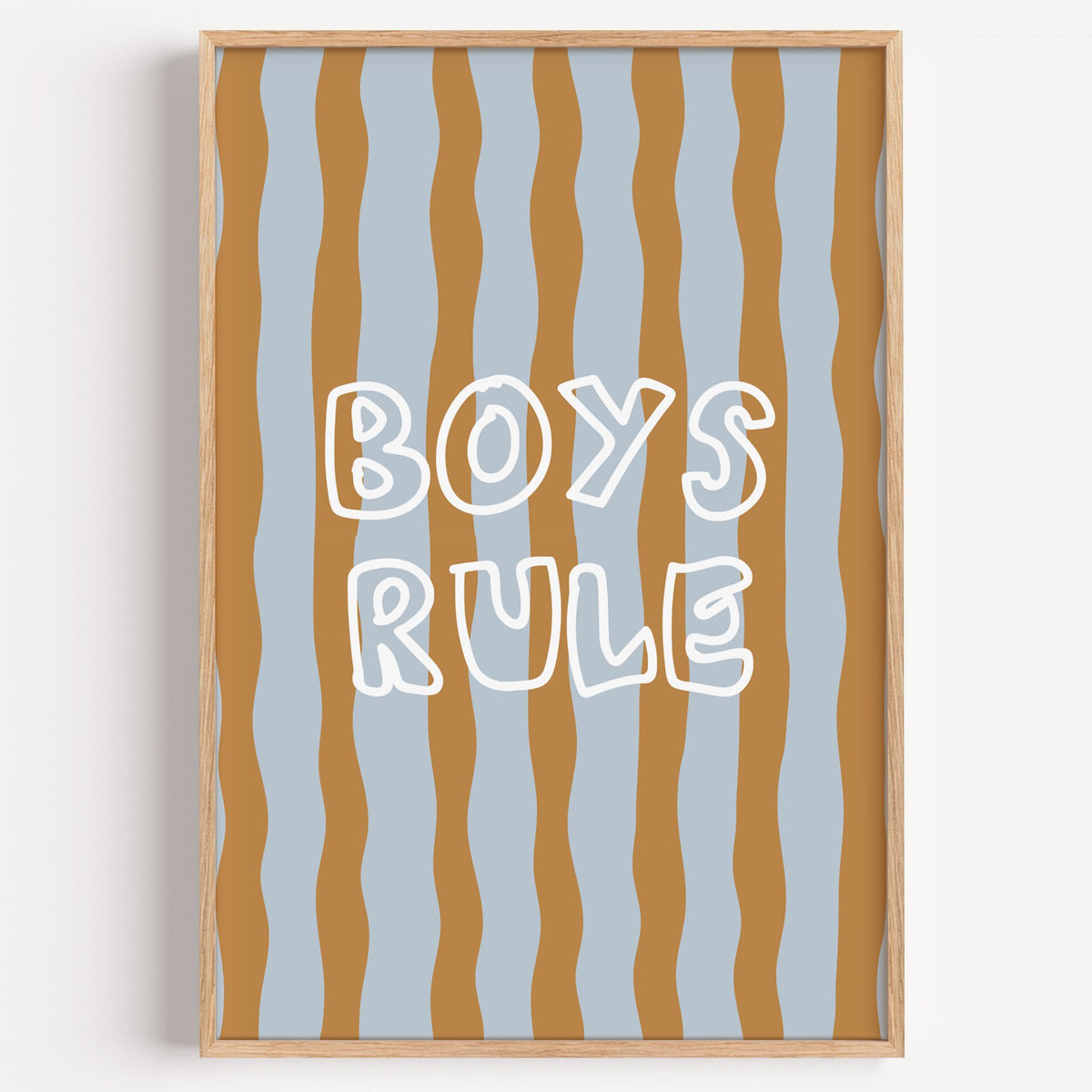 Boys rule wavy stripe nursery print in a light oak frame on a plain white wall