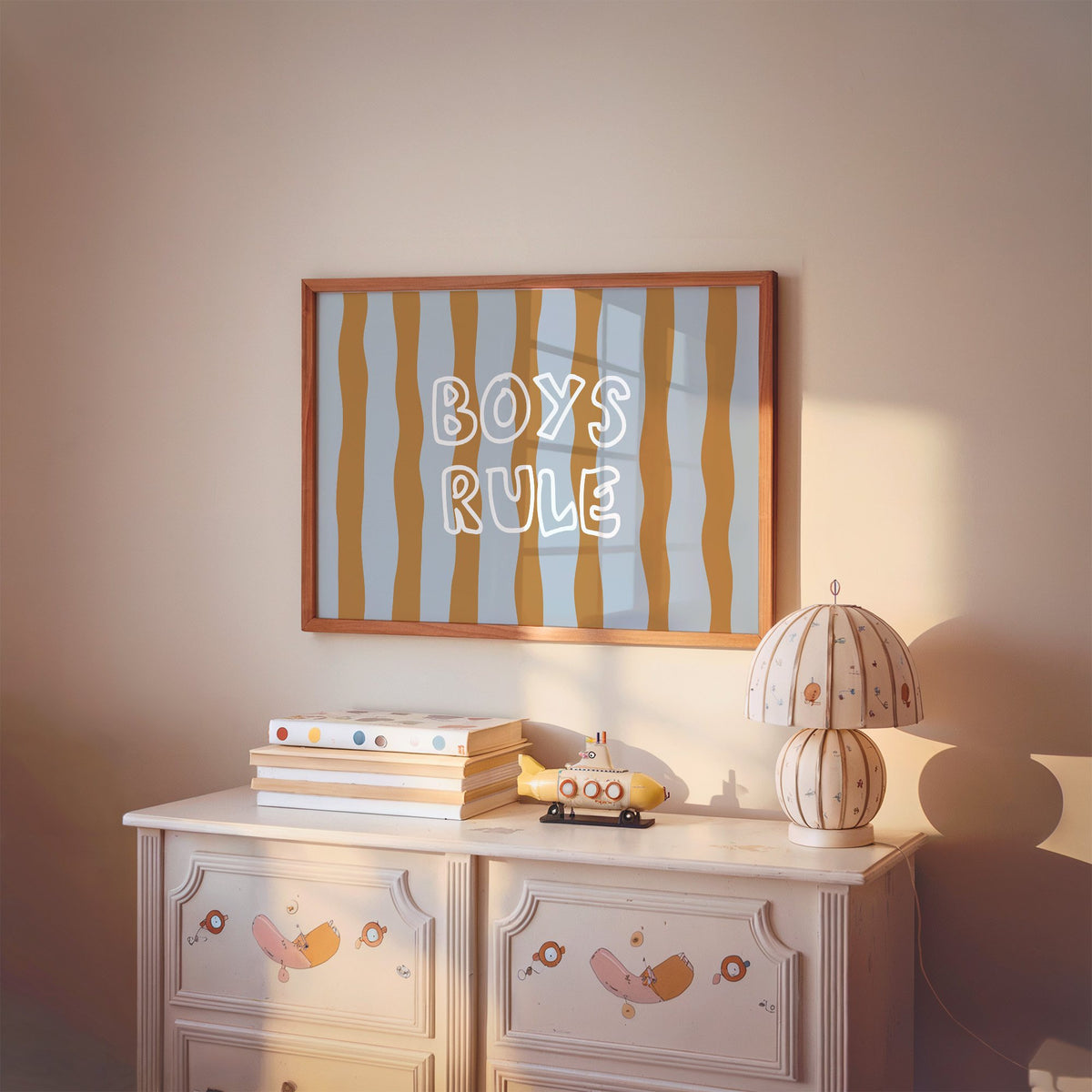 Landscape boys rule wavy stripe nursery print in a cherry wood frame above a painted dresser and lamp