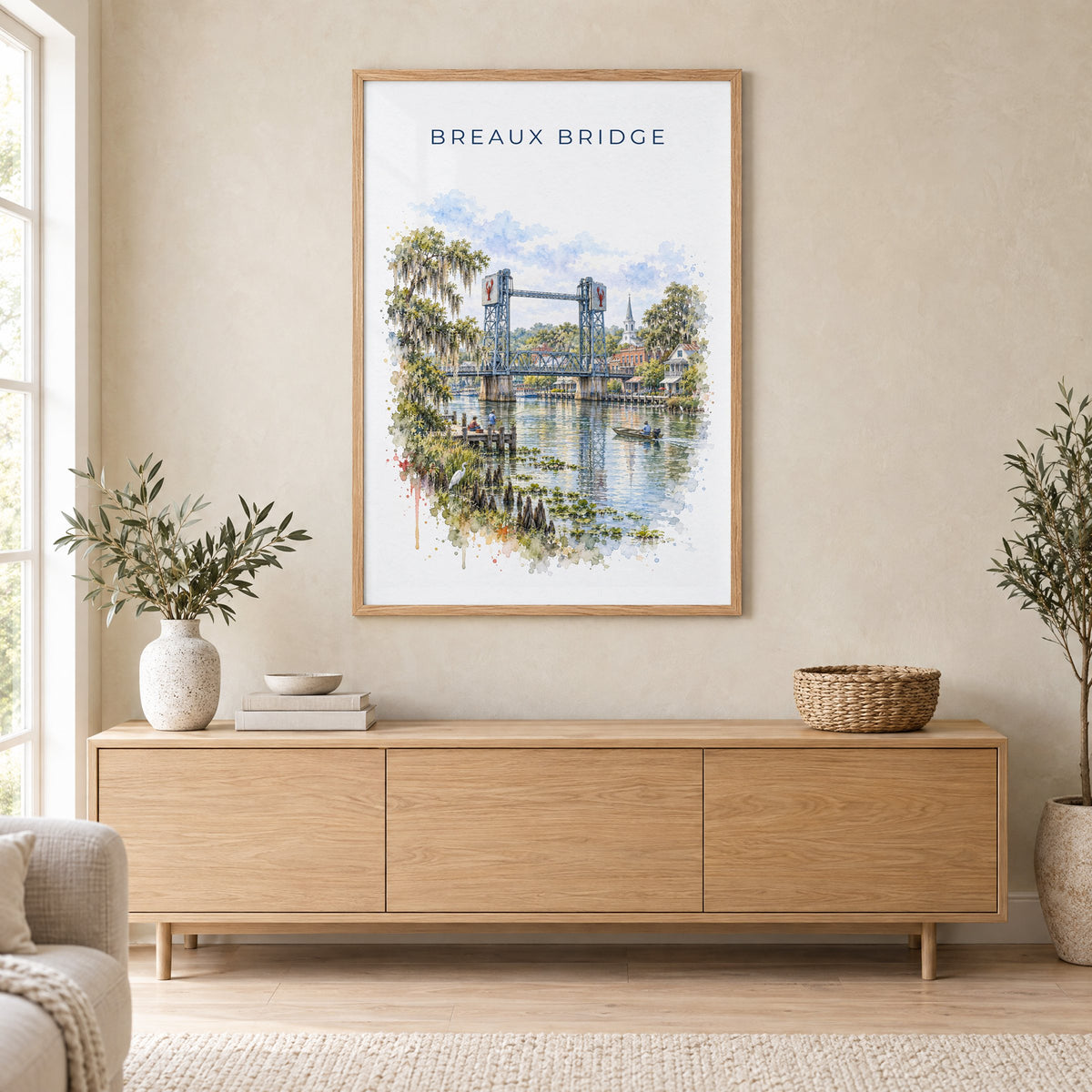 Breaux Bridge, Louisiana watercolor print in an oak frame above a light wood sideboard in a Scandinavian living room