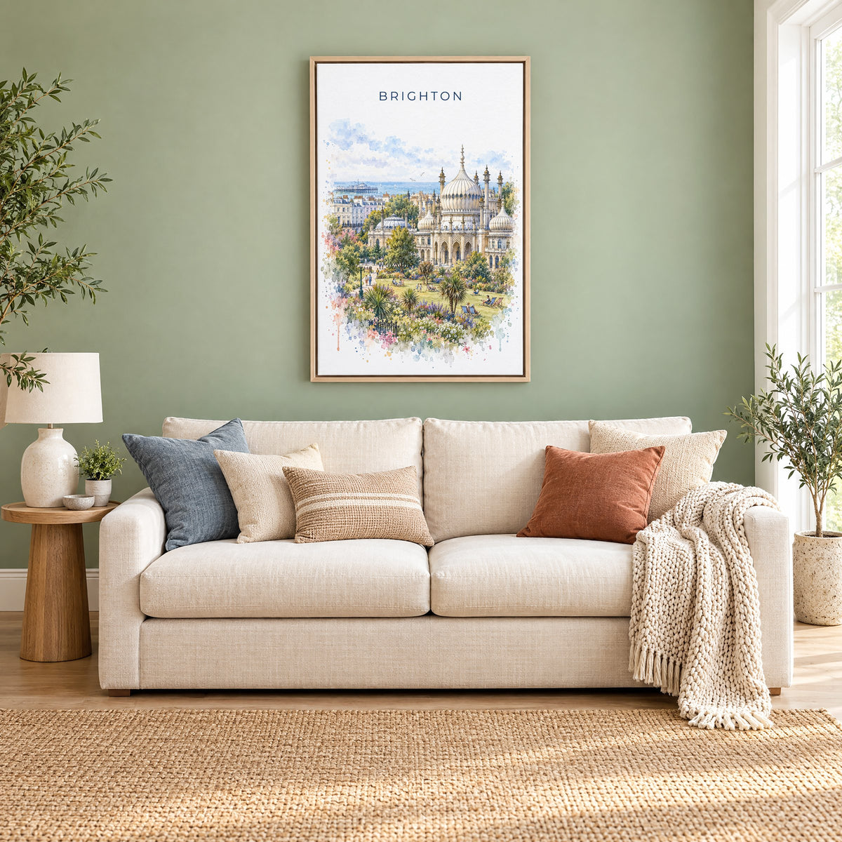 Brighton watercolor print as a natural floater canvas above a cream linen sofa on a sage green wall