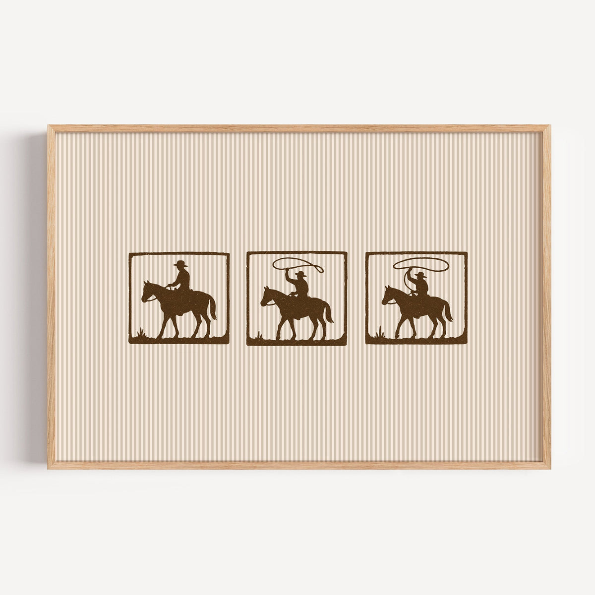 Bronco riders film strip print in a light oak frame on a plain white wall