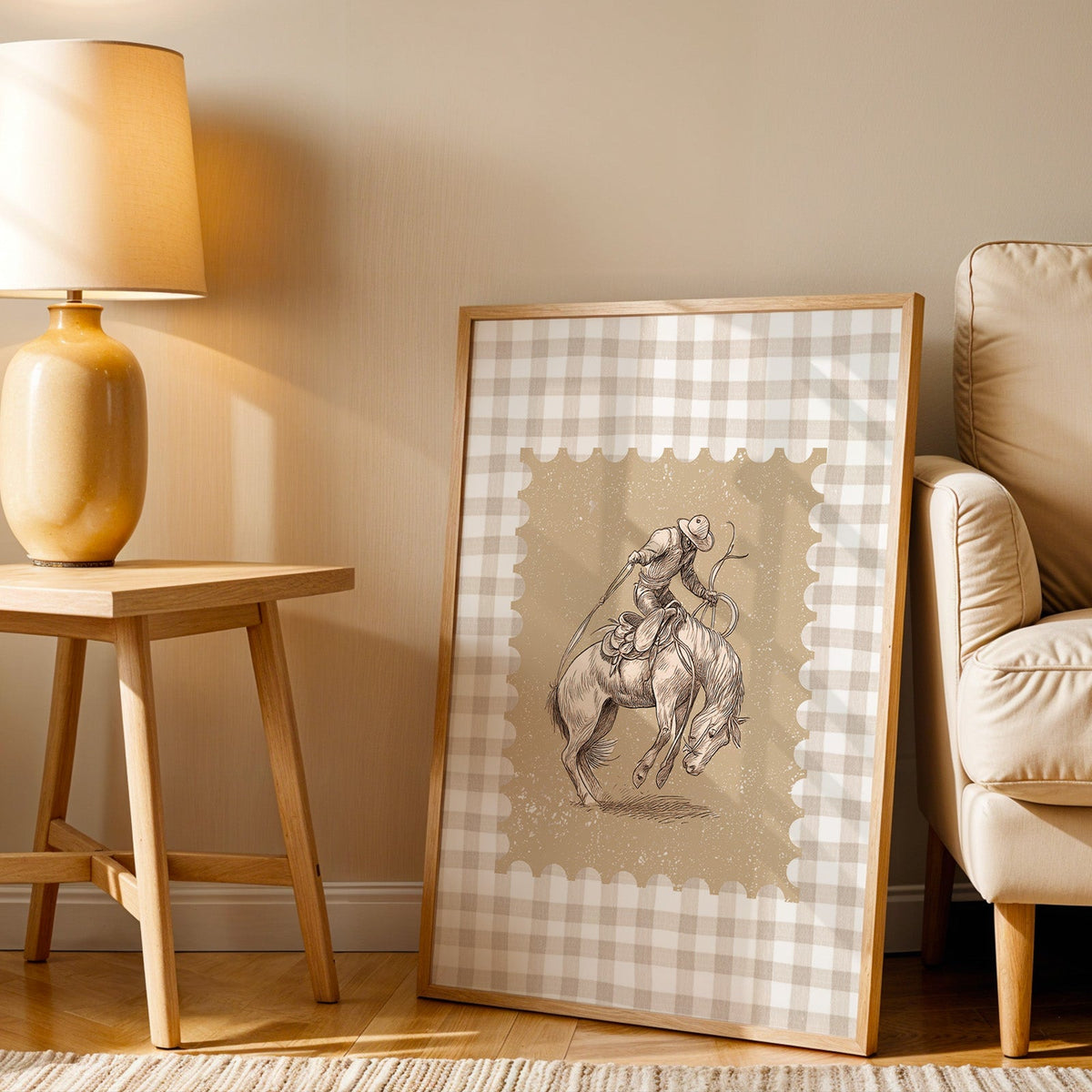 Bronco rider gingham print in an oak frame beside an amber ceramic lamp