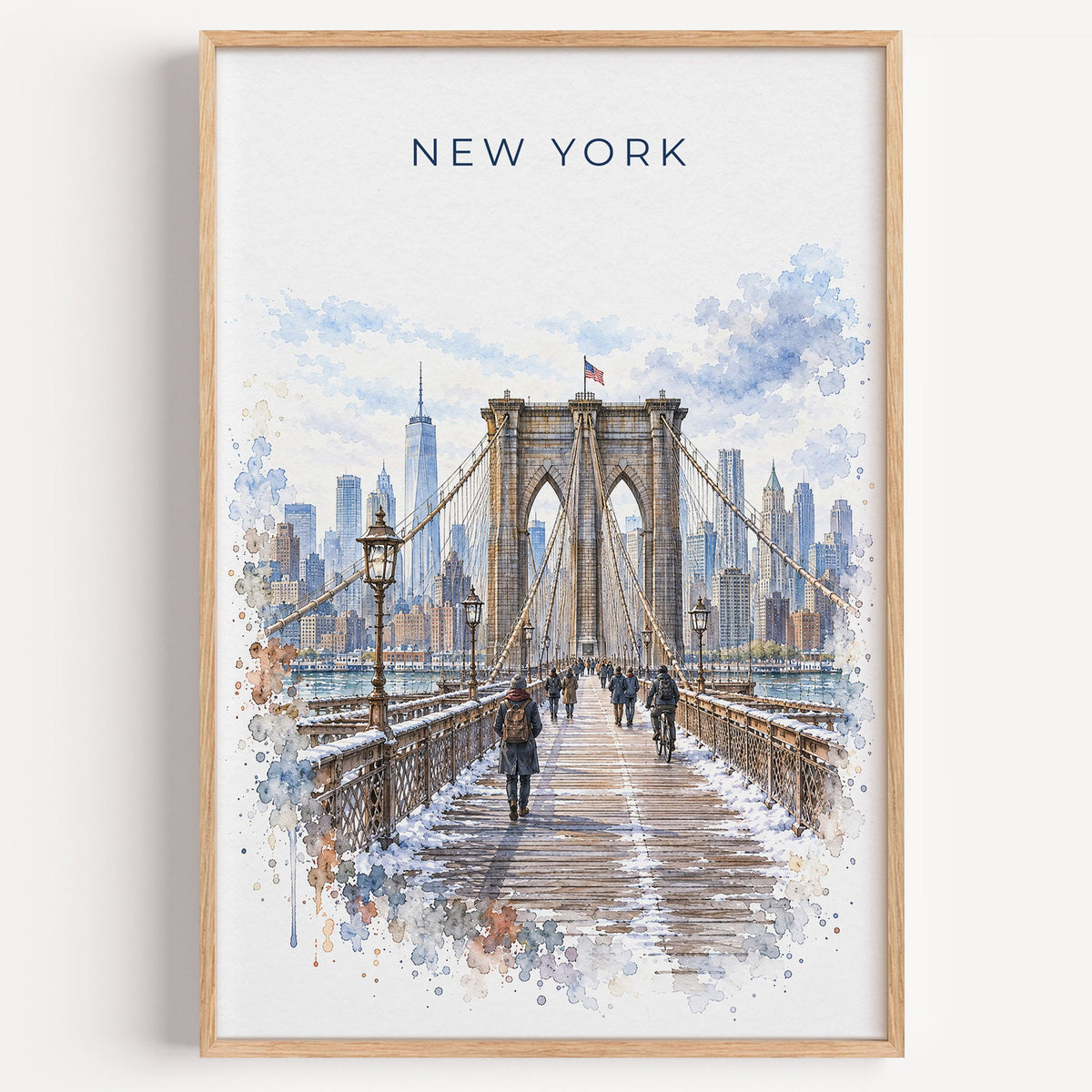 Brooklyn Bridge watercolor print in a light oak frame on a plain white wall
