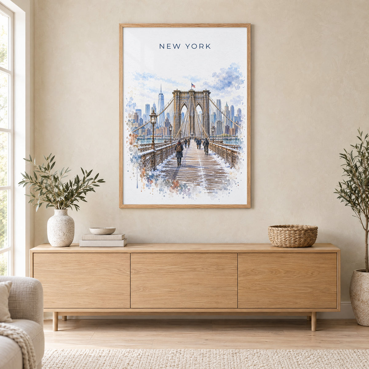 Brooklyn Bridge watercolor print in an oak frame above a light wood sideboard in a Scandinavian living room