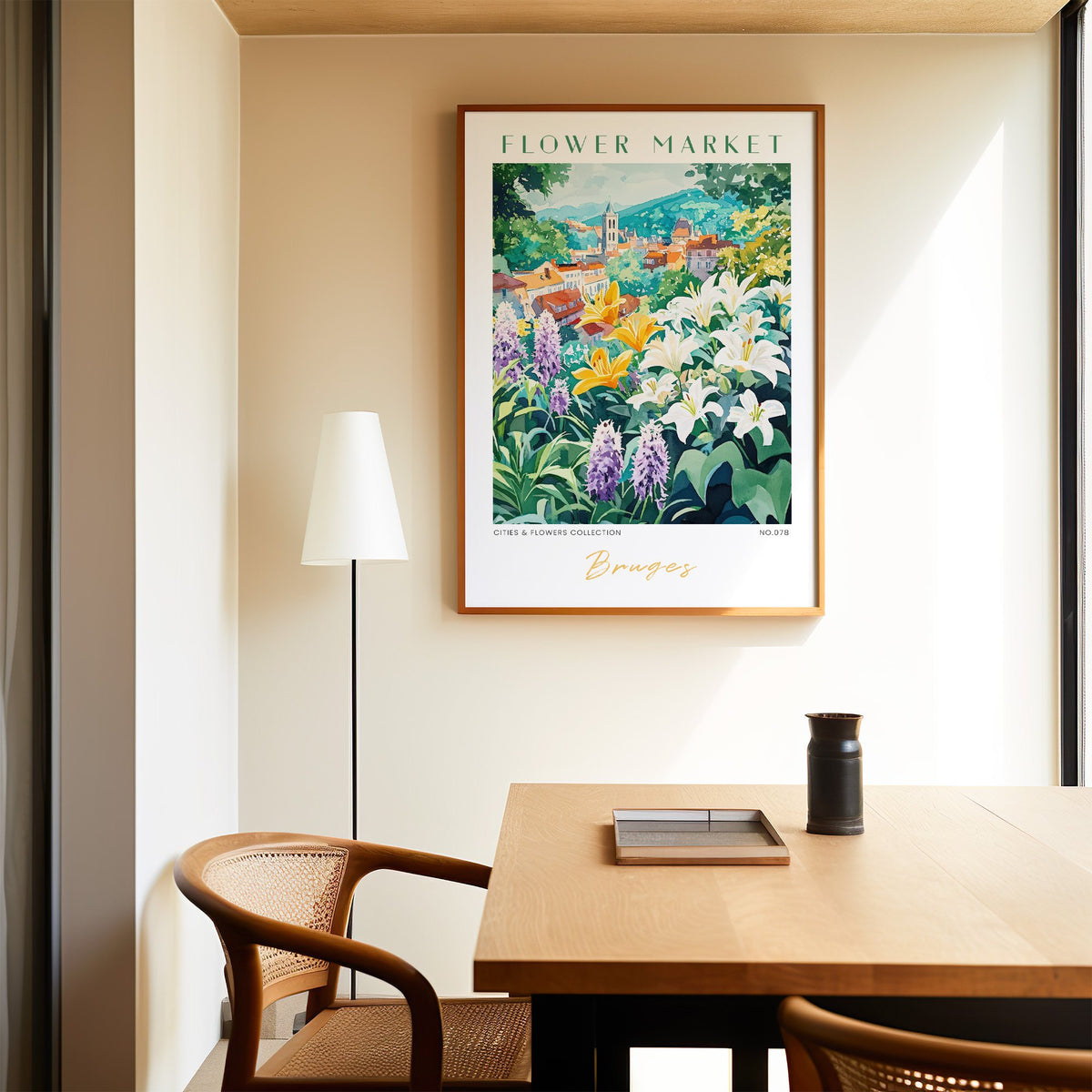 Bruges flower market print in an oak frame above a dining table and cane chair