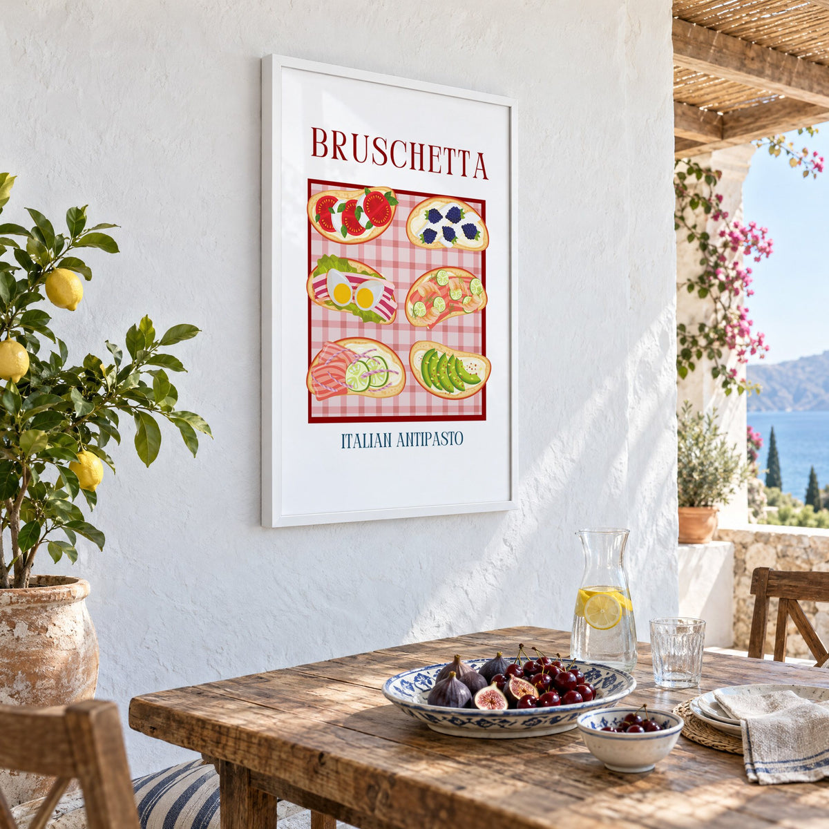 BRUSCHETTA six toasts pink gingham print in a white frame on a whitewashed terrace wall above a lunch table with figs and cherries, seen at an angle