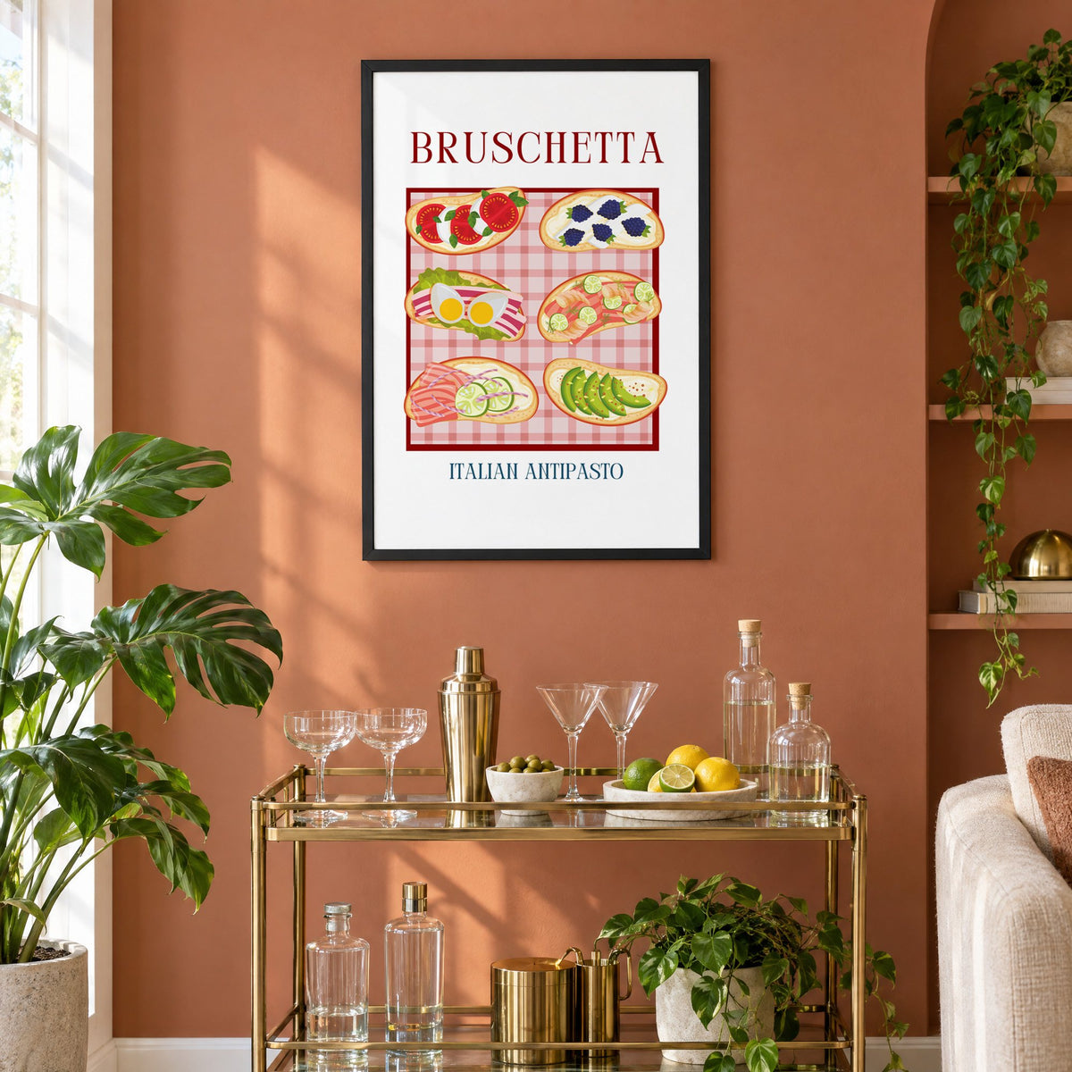 BRUSCHETTA six toasts pink gingham print in a black frame on a terracotta wall above a brass bar cart with coupes and citrus