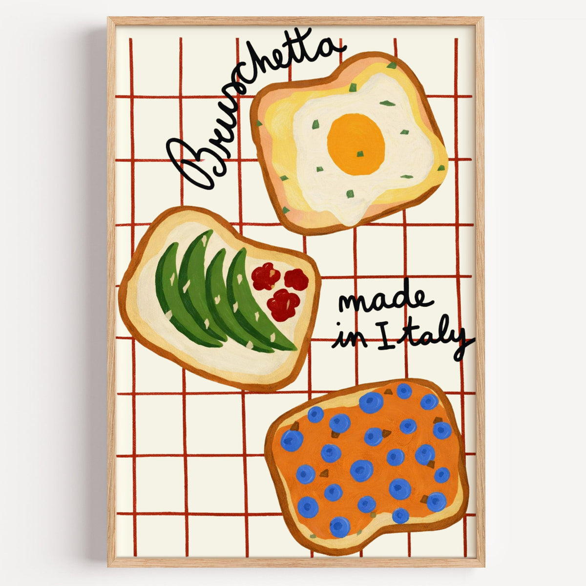 Bruschetta kitchen print in a light oak frame on a plain white wall