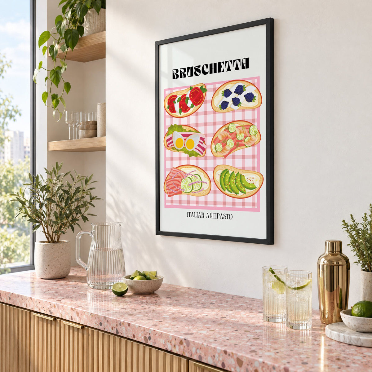 BRUSCHETTA pink gingham print in a black frame above a pink terrazzo cocktail counter with limes, seen at an angle