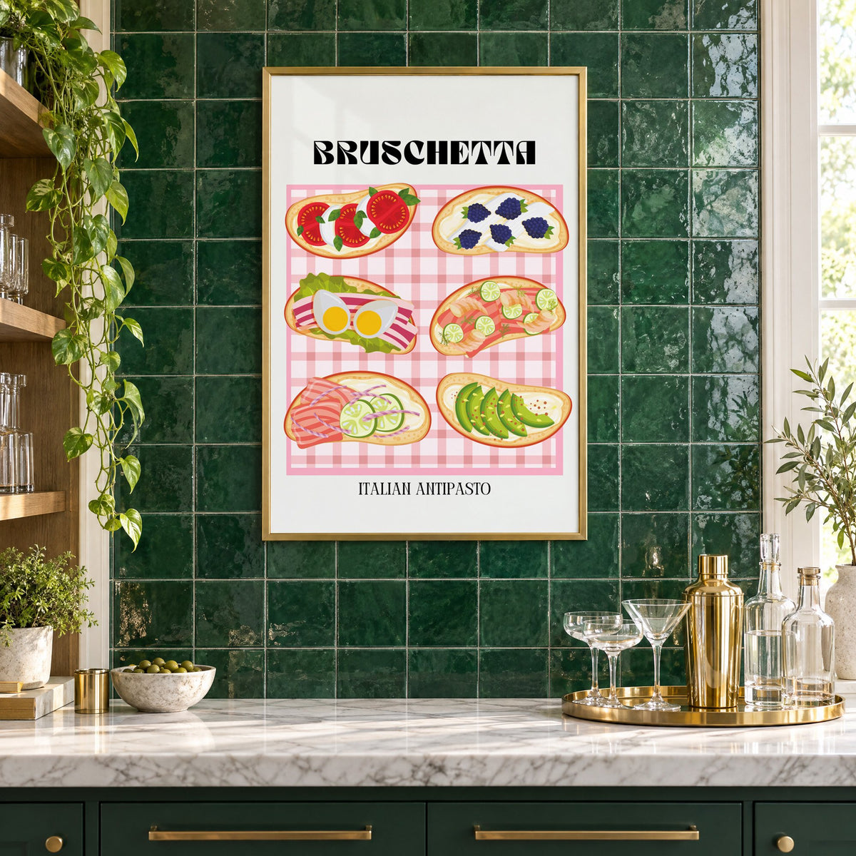 BRUSCHETTA pink gingham print in a brass frame on emerald green tiles above a home bar with coupe glasses