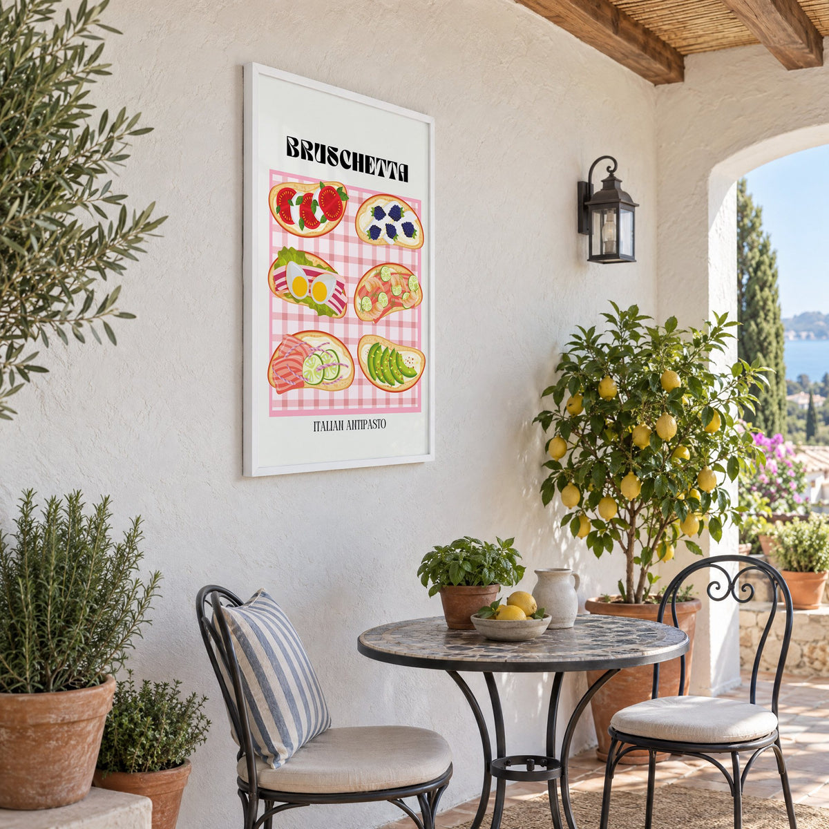 BRUSCHETTA pink gingham print in a white frame on a sunny patio wall beside a potted lemon tree