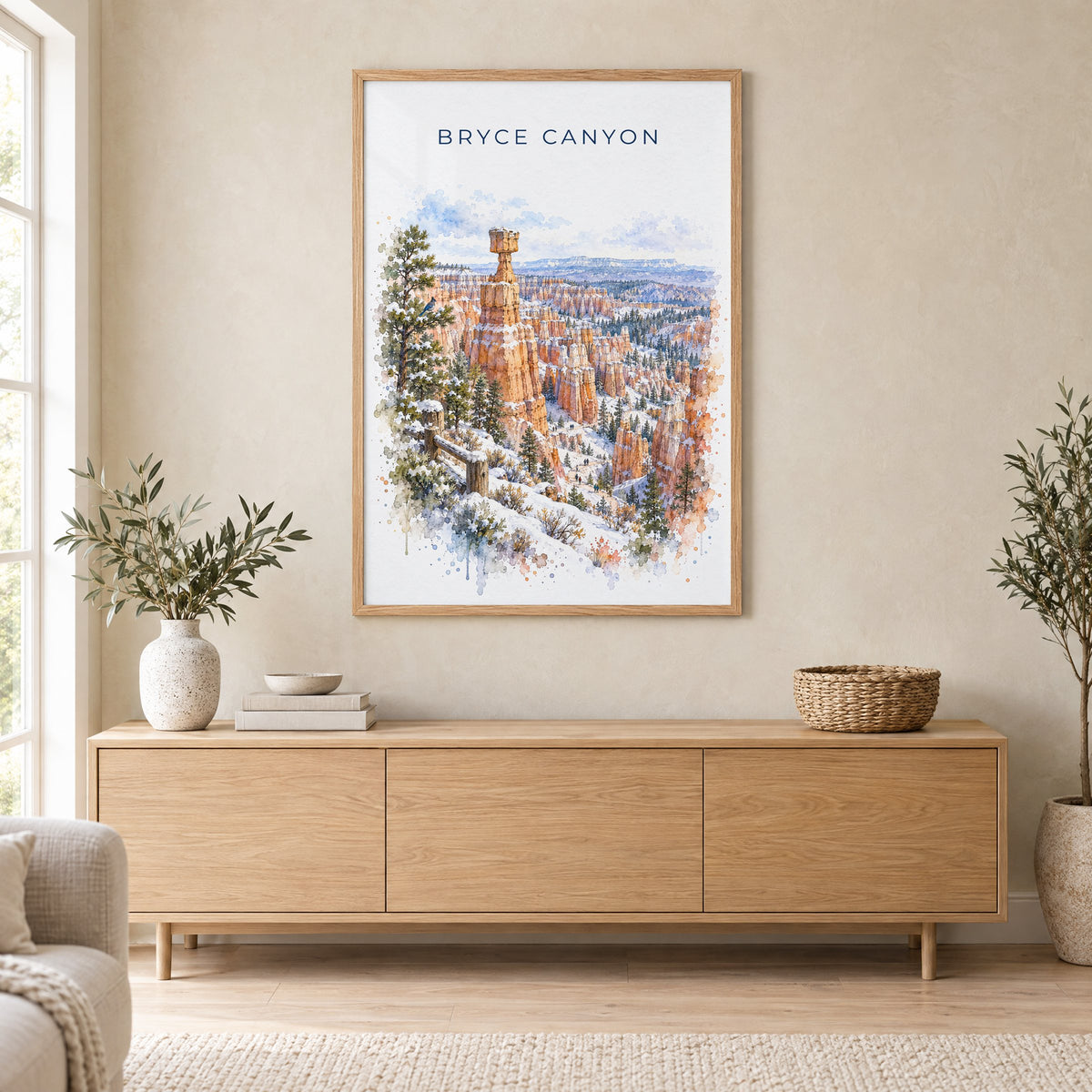 Bryce Canyon National Park watercolor print in an oak frame above a light wood sideboard in a Scandinavian living room