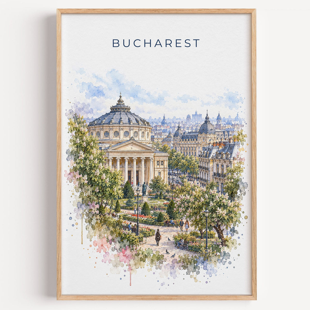 Bucharest watercolor print in a light oak frame on a plain white wall