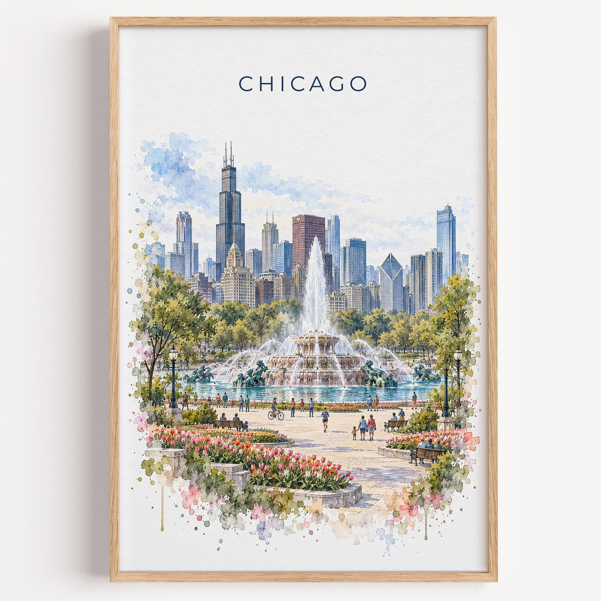 Buckingham Fountain Chicago watercolor print in a light oak frame on a plain white wall