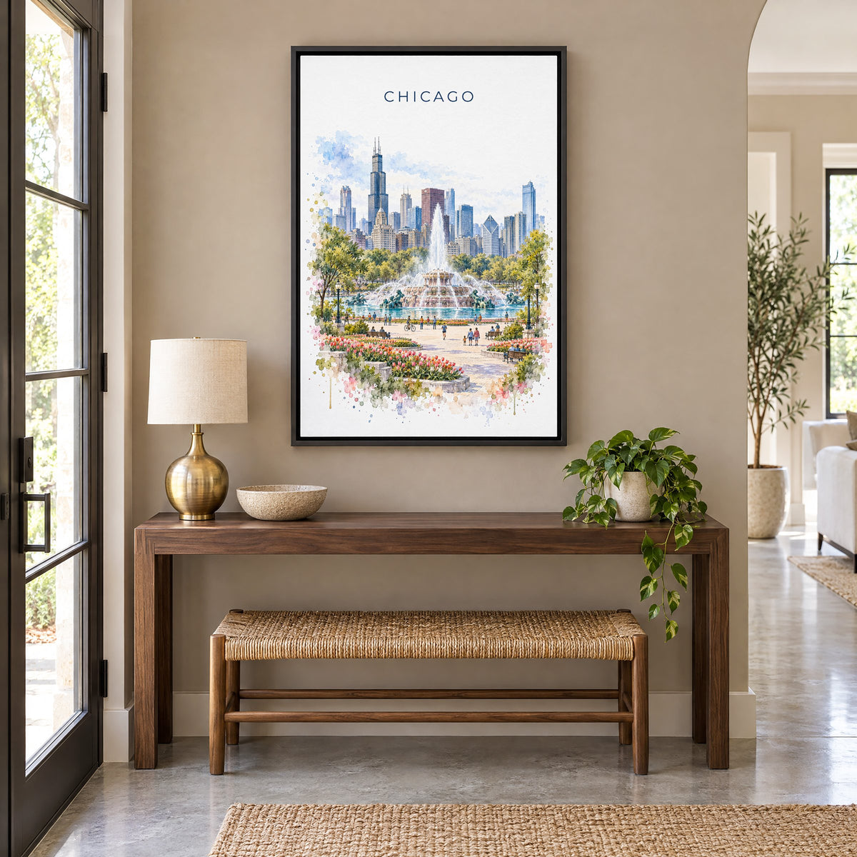 Buckingham Fountain Chicago watercolor print as a black floater canvas above a walnut console and woven bench in an entryway
