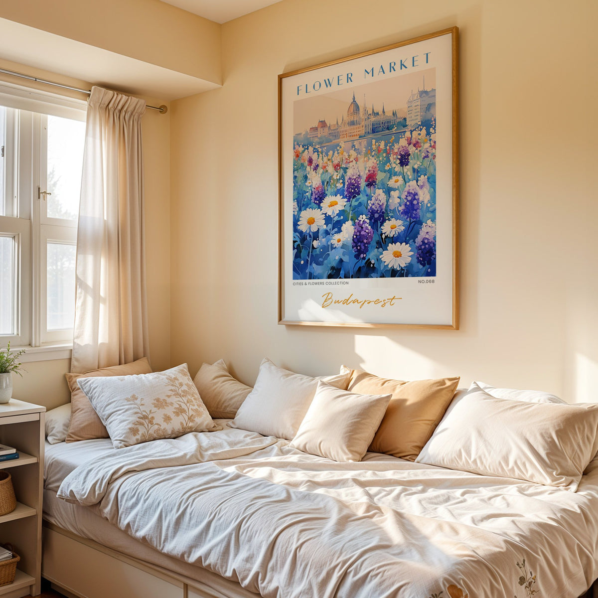 Budapest flower market print in an oak frame above a cream daybed in a sunny bedroom
