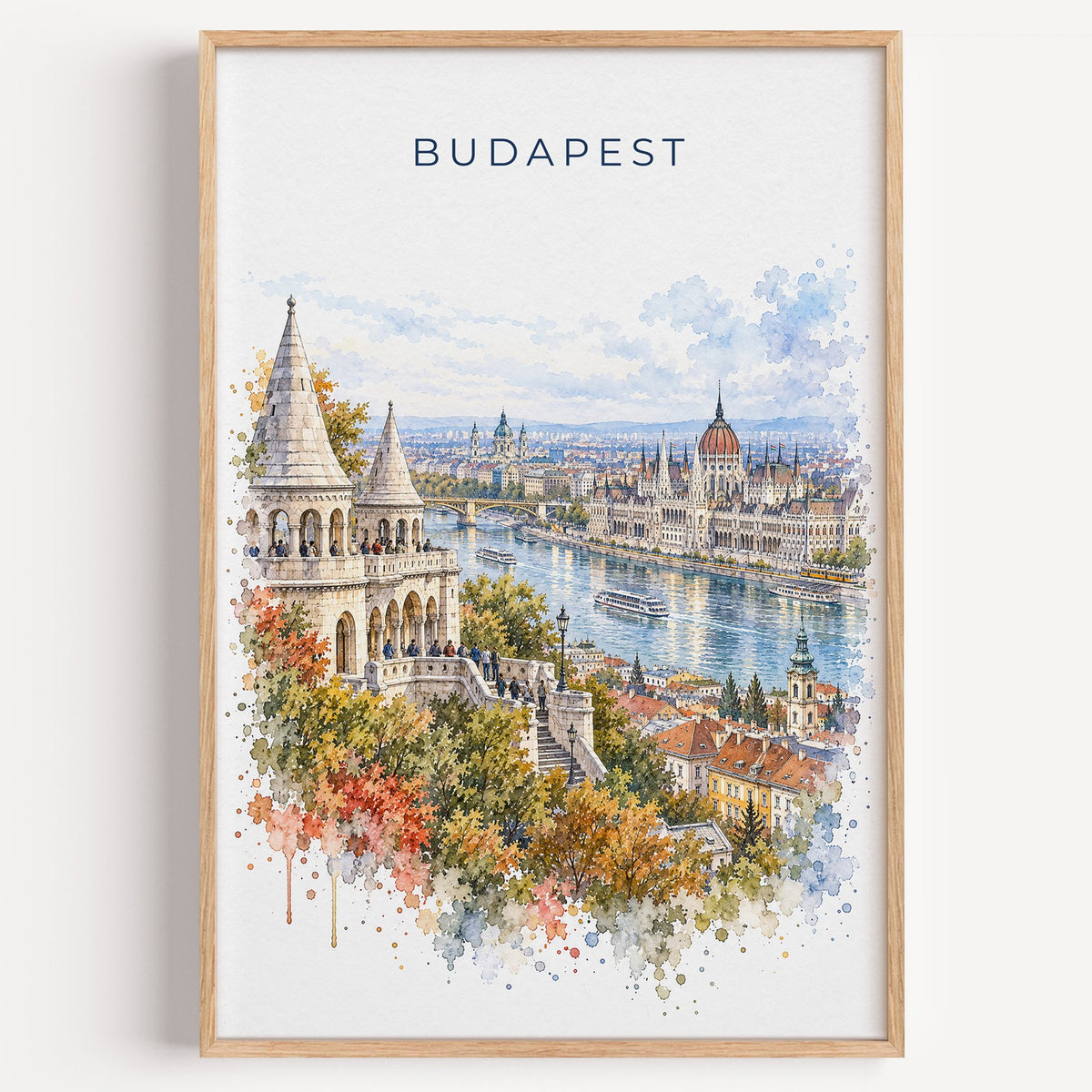 Budapest watercolor print in a light oak frame on a plain white wall