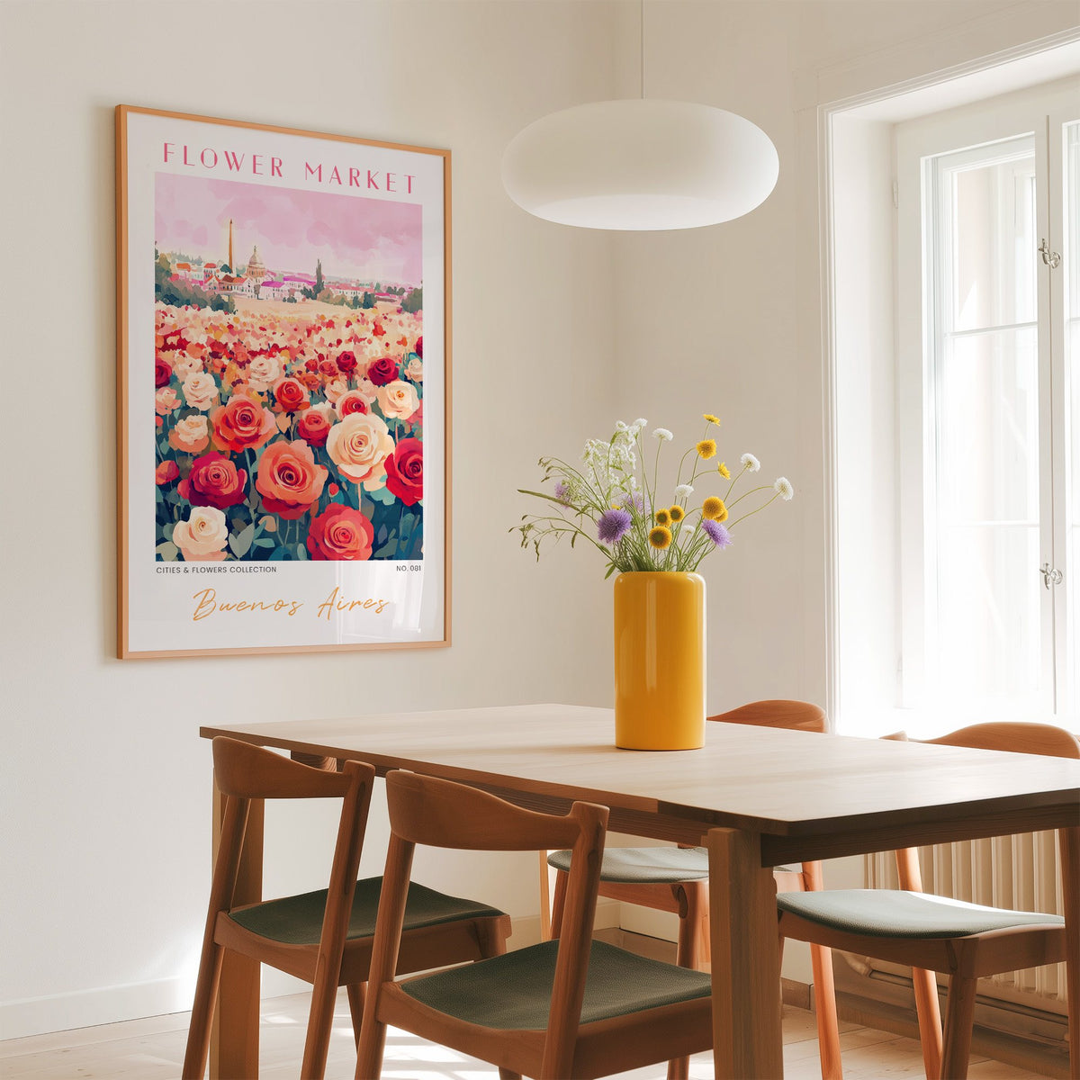 Buenos Aires flower market print in an oak frame above a dining table with a yellow vase and white pendant light