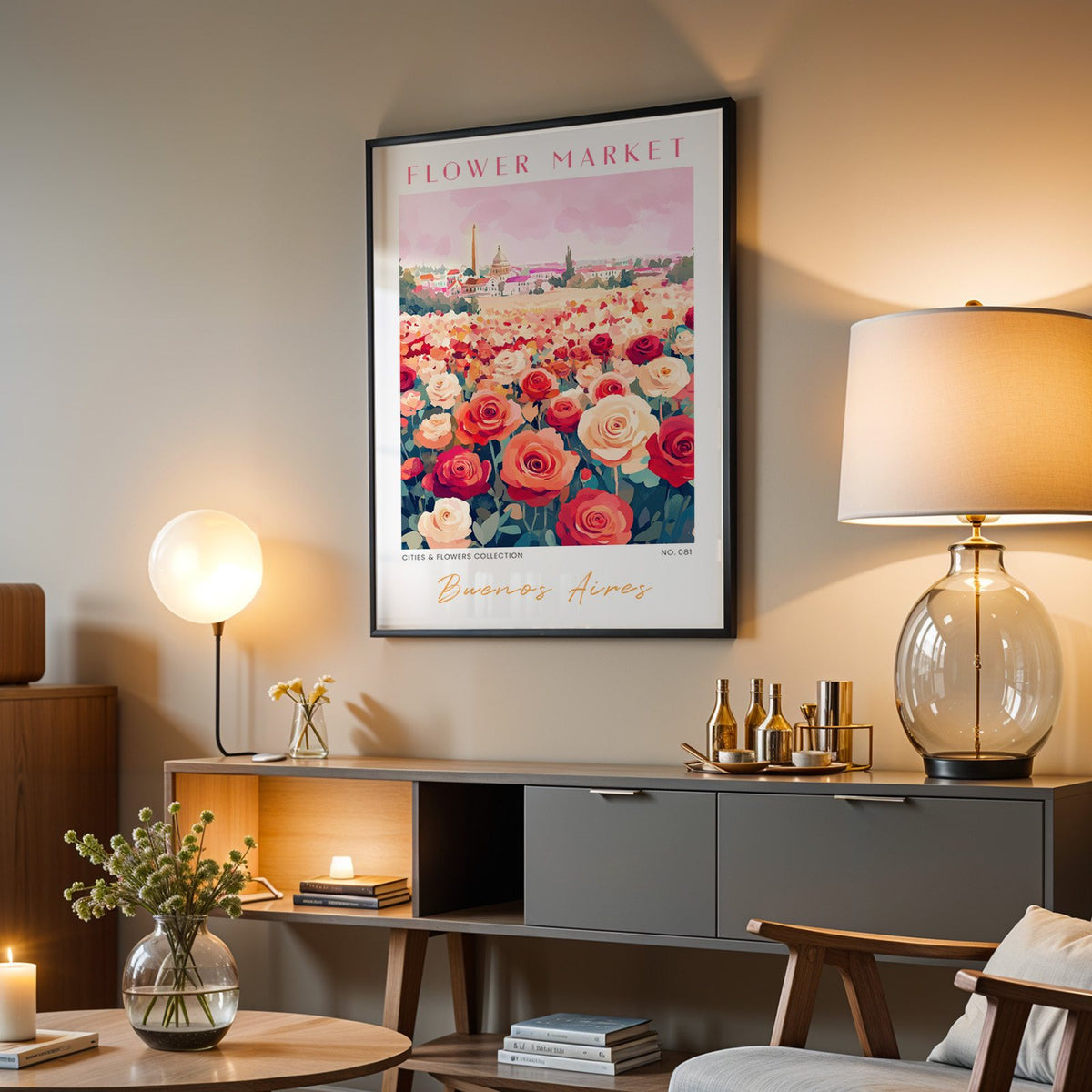 Buenos Aires flower market print in a black frame above a grey media console with a glass table lamp