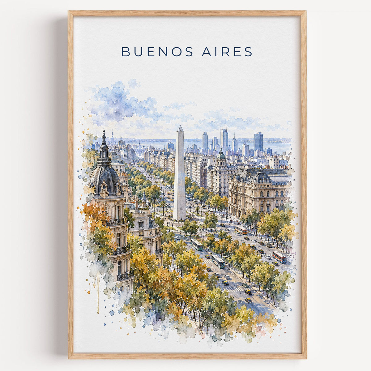 Buenos Aires watercolor print in a light oak frame on a plain white wall