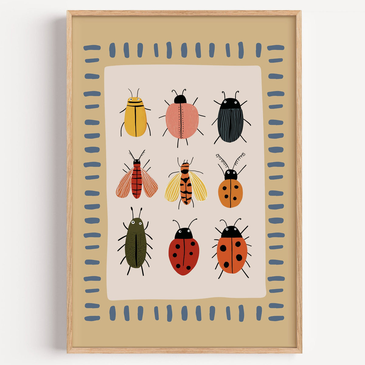 Bug collection chart nursery print in a light oak frame on a plain white wall
