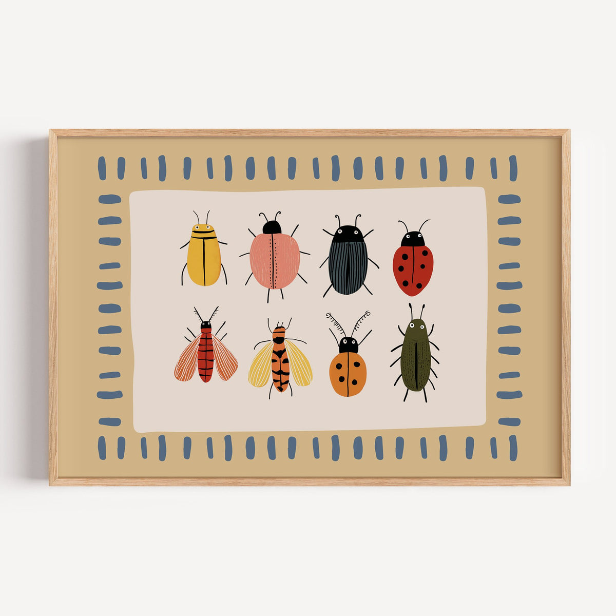 Landscape bug collection chart nursery print in a light oak frame on a plain white wall