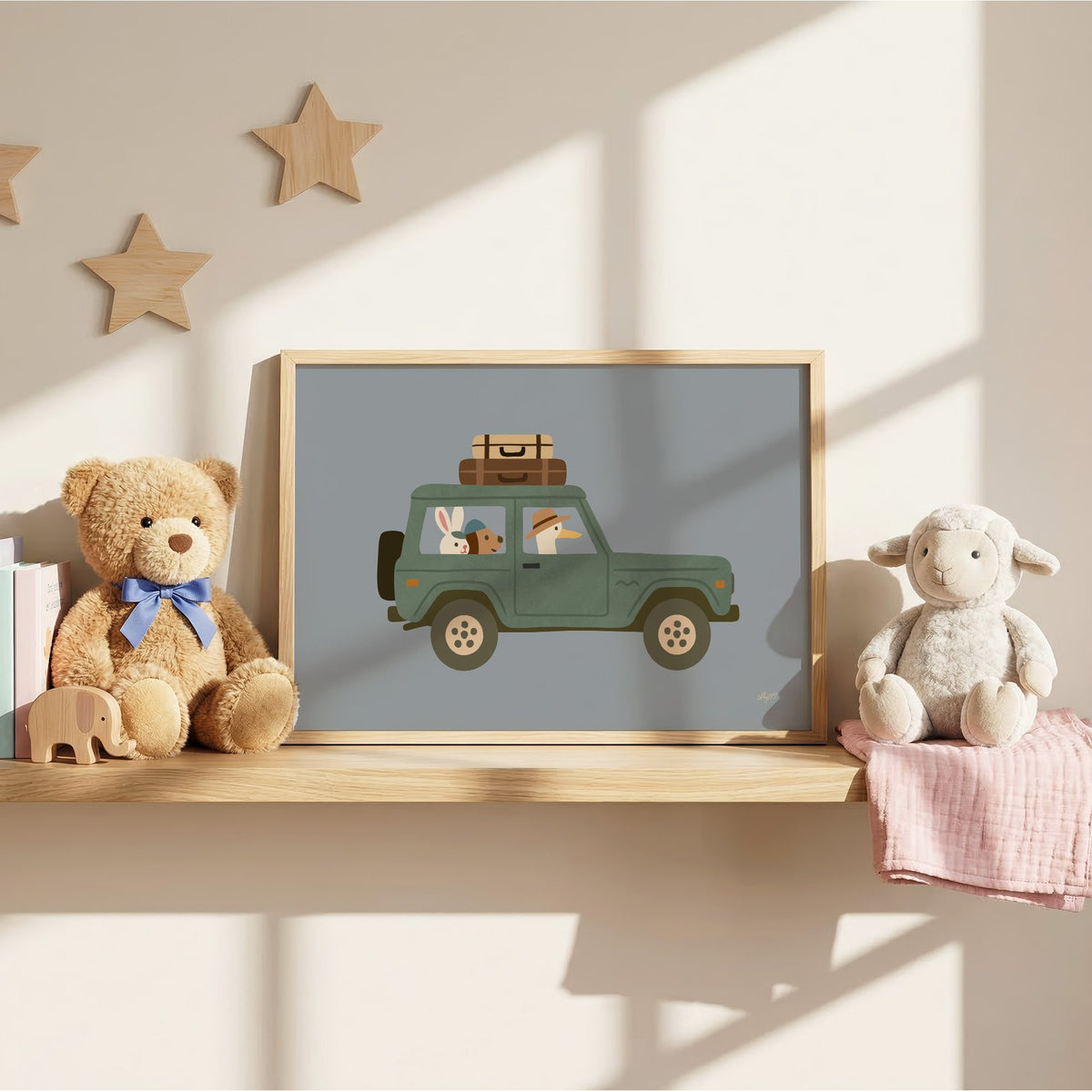 Animals riding green vintage suv nursery print in an oak frame on a wall shelf between a teddy bear and a toy lamb