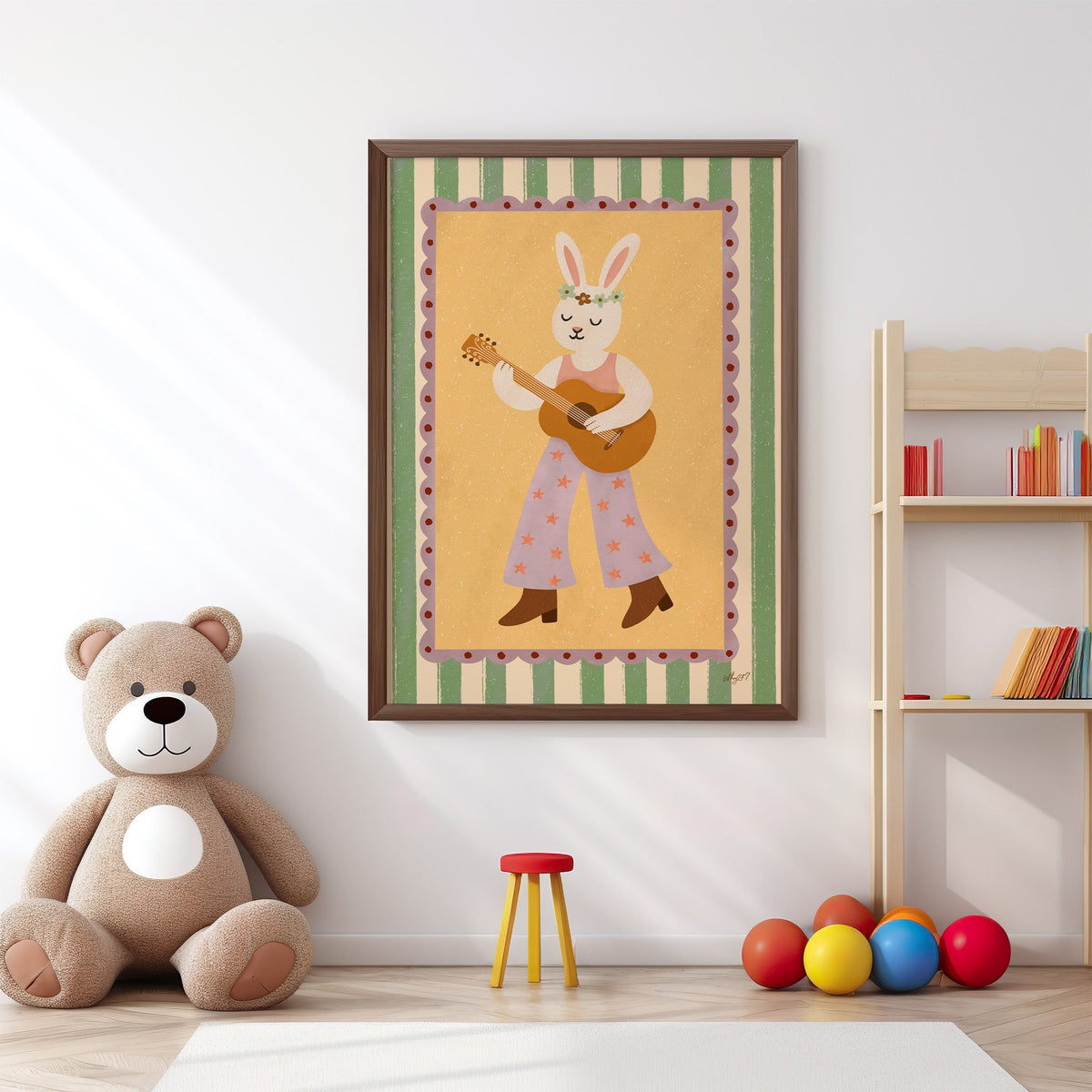 Bunny playing guitar with flower crown nursery print in a walnut frame above a big teddy bear by a bookshelf