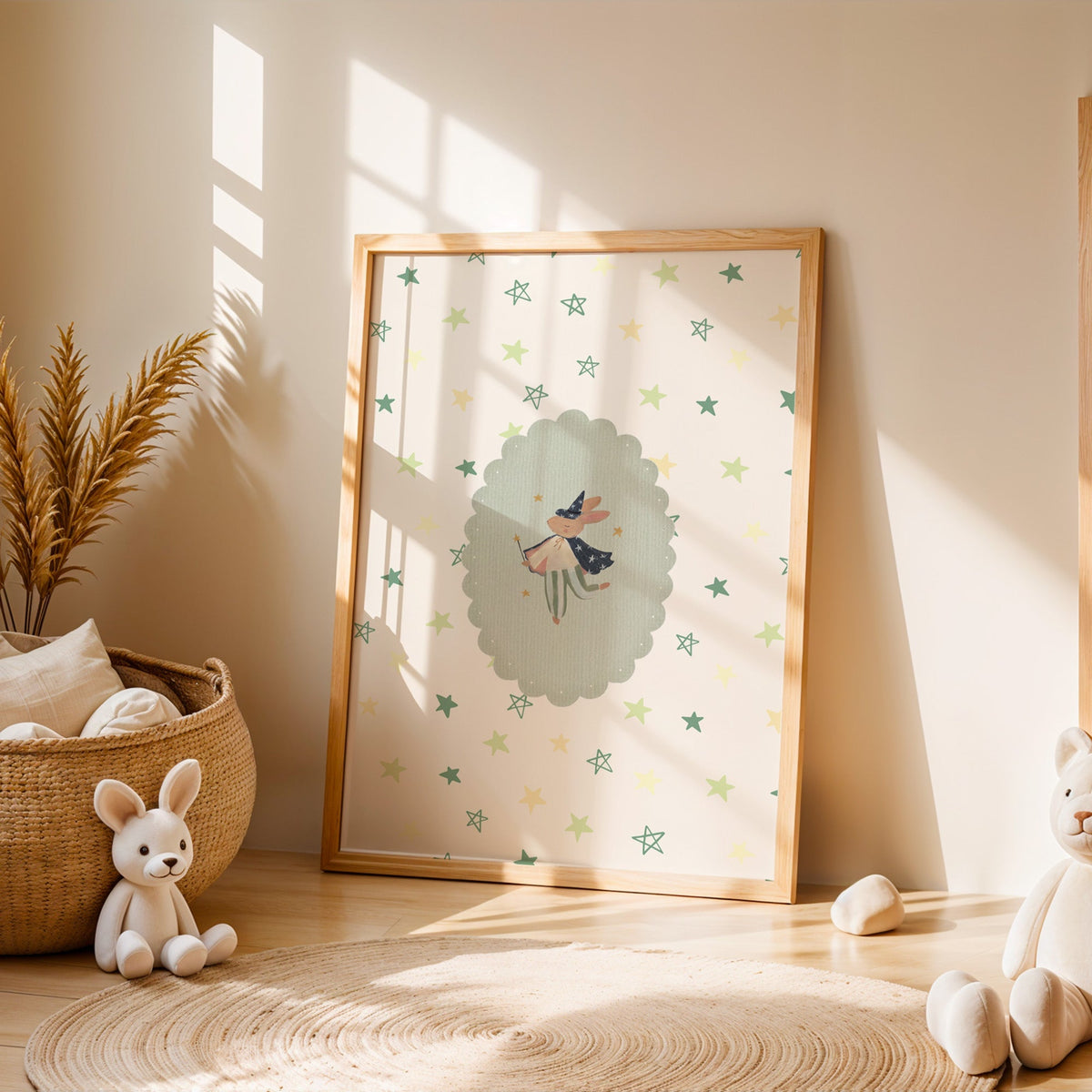 Bunny wizard with wand in sage oval nursery print in an oak frame leaning on a sunlit floor by a woven basket