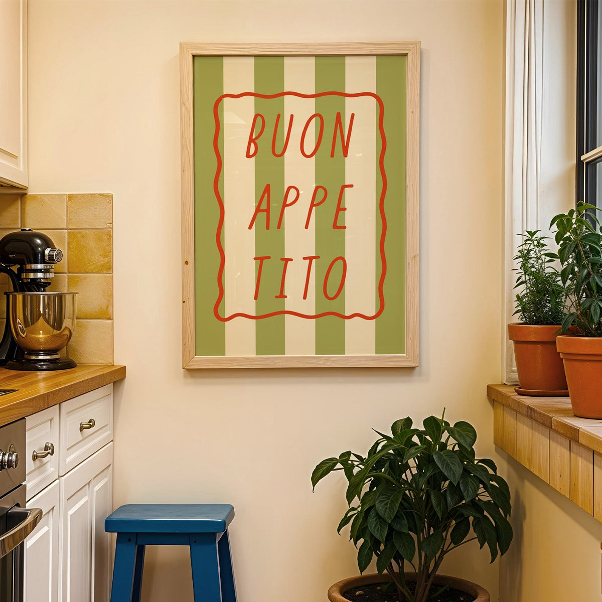 Buon appetito print in a wood frame on a yellow tiled kitchen wall