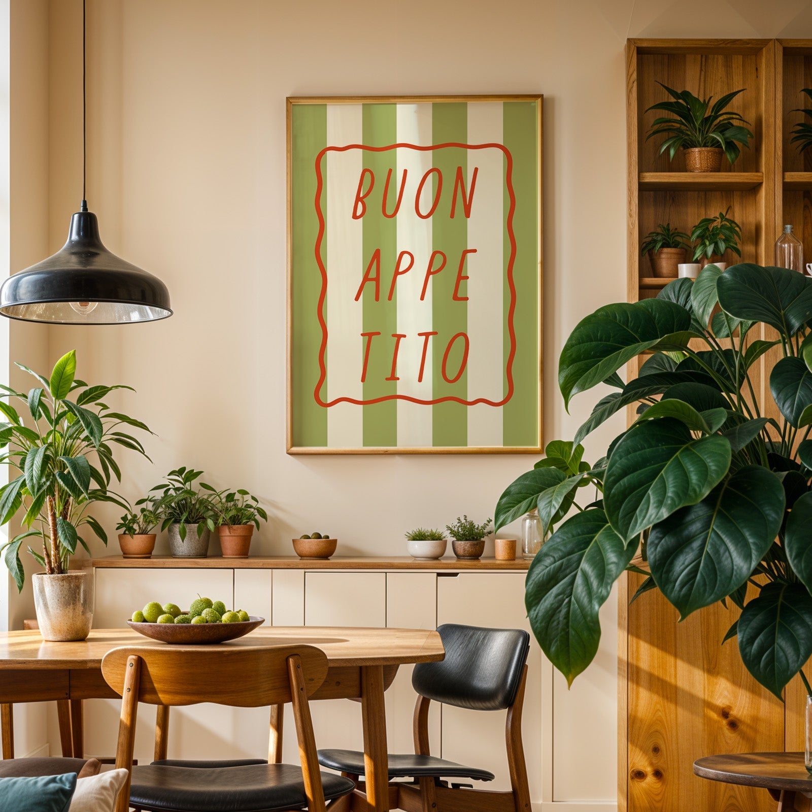 Buon appetito print in an oak frame above a sideboard in a plant-filled dining room