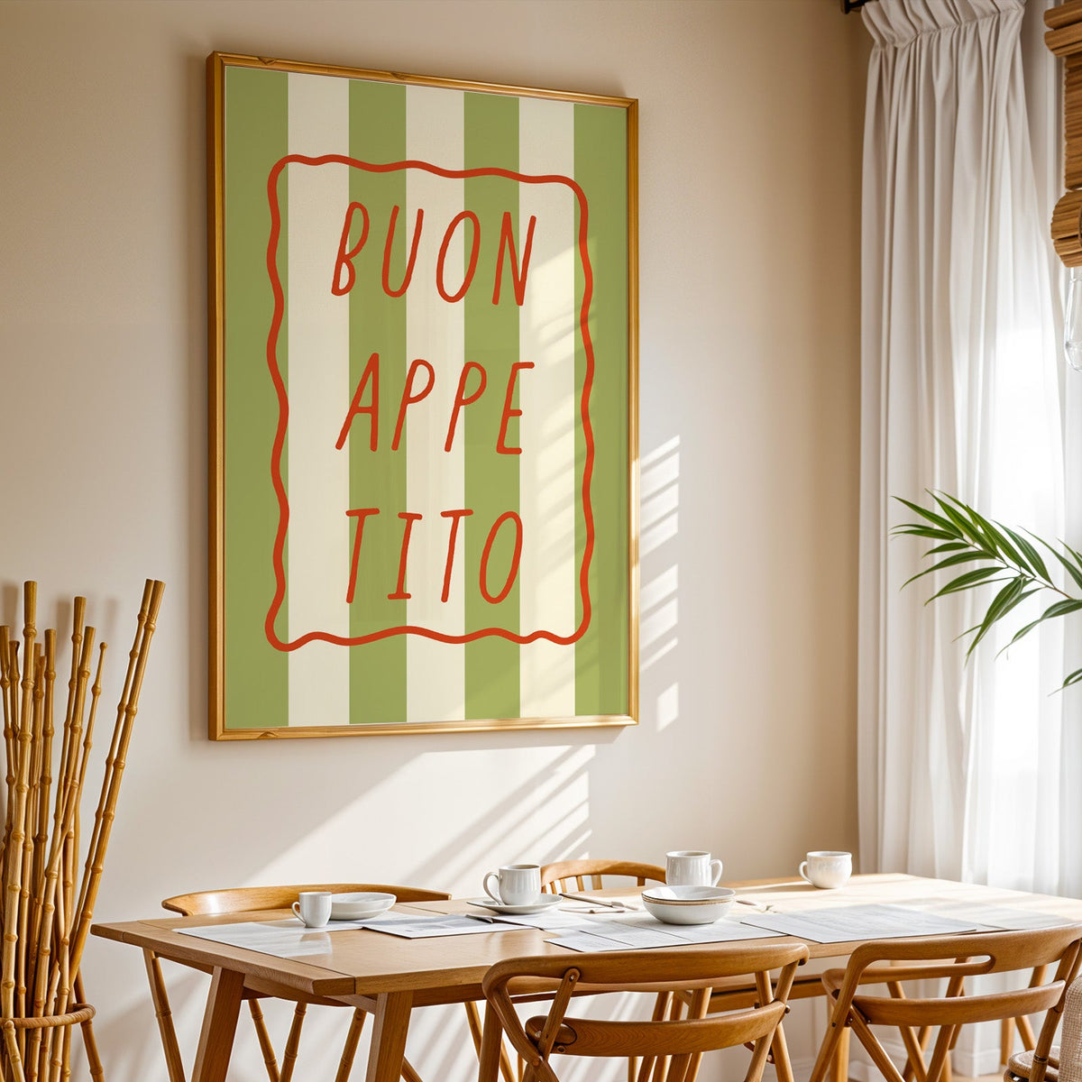Buon appetito print in a gold frame above a sunlit breakfast table