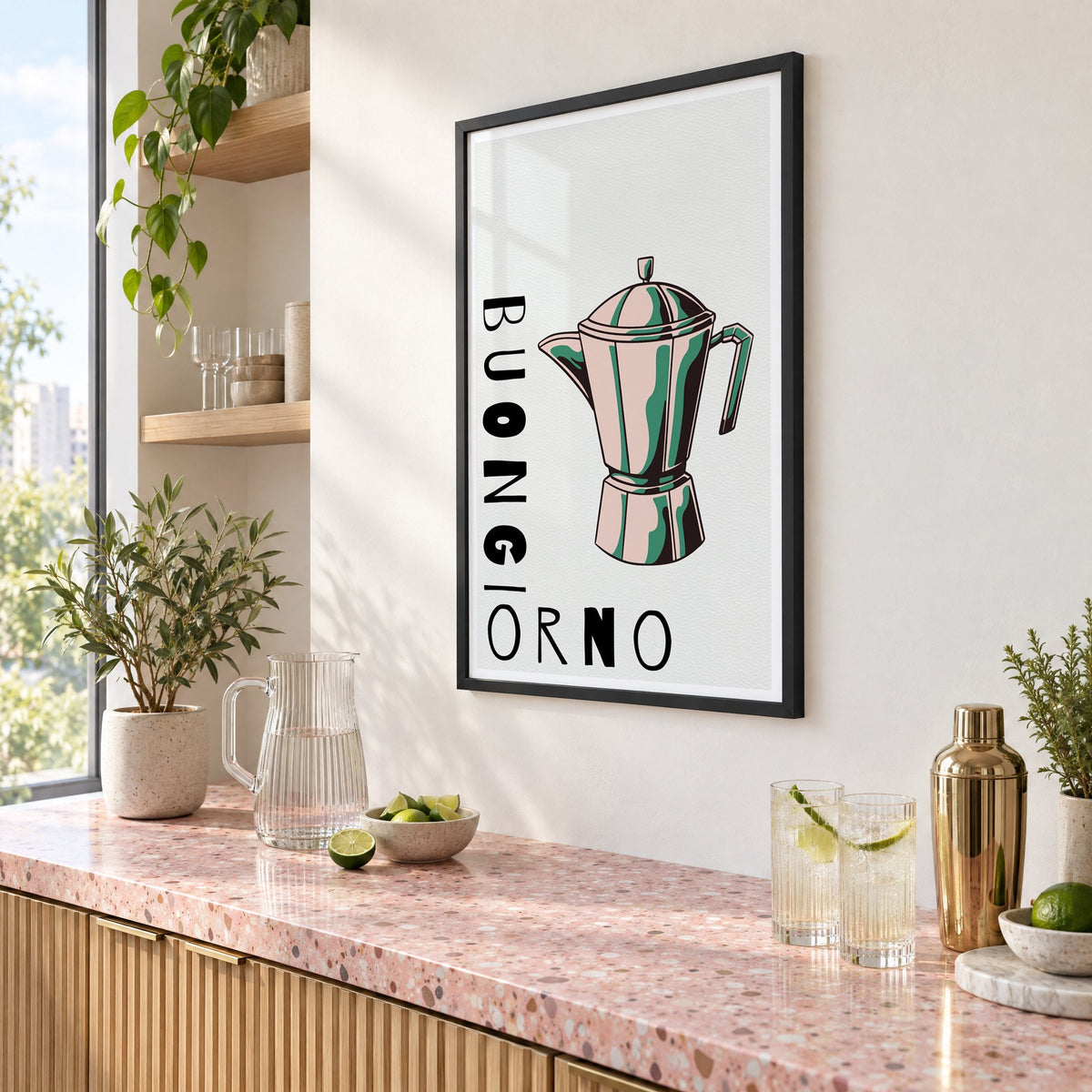BUONGIORNO moka pot pop art print in a black frame above a pink terrazzo cocktail counter with limes, seen at an angle
