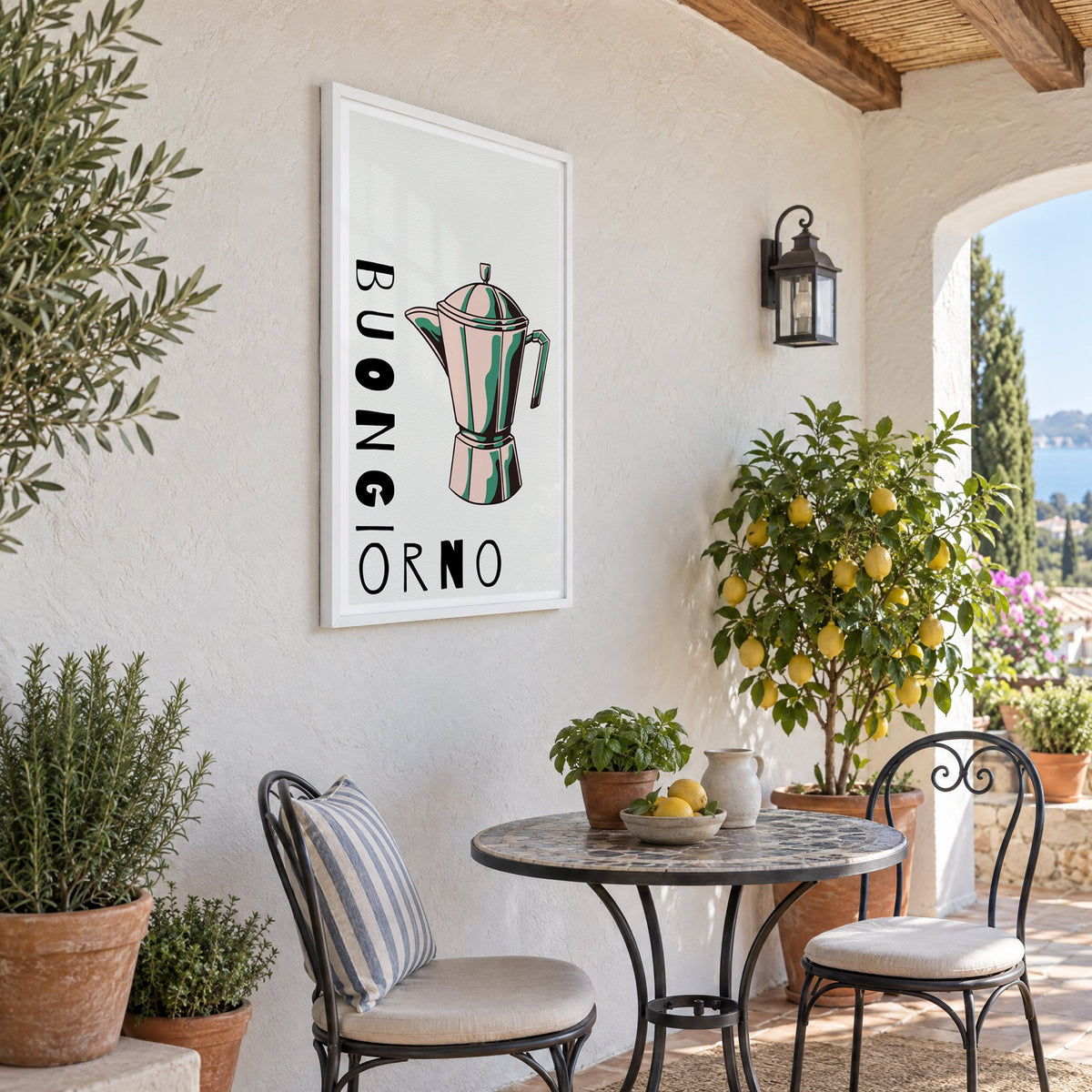 BUONGIORNO moka pot pop art print in a white frame on a sunny patio wall beside a potted lemon tree