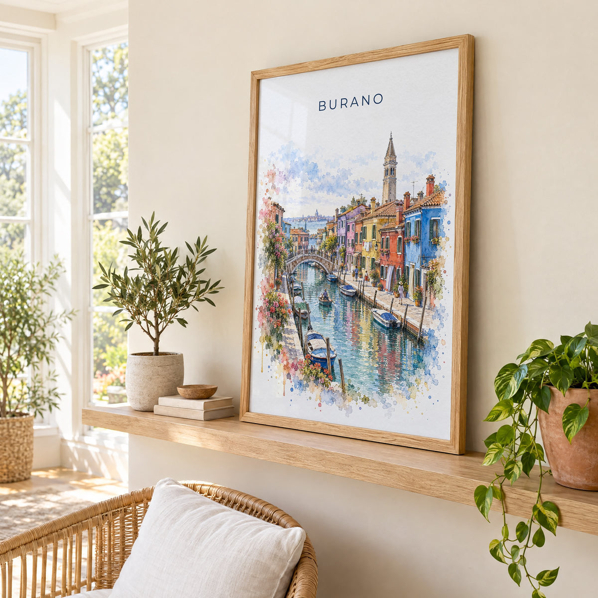Burano watercolor print in an oak frame on a picture ledge in a sunlit sunroom