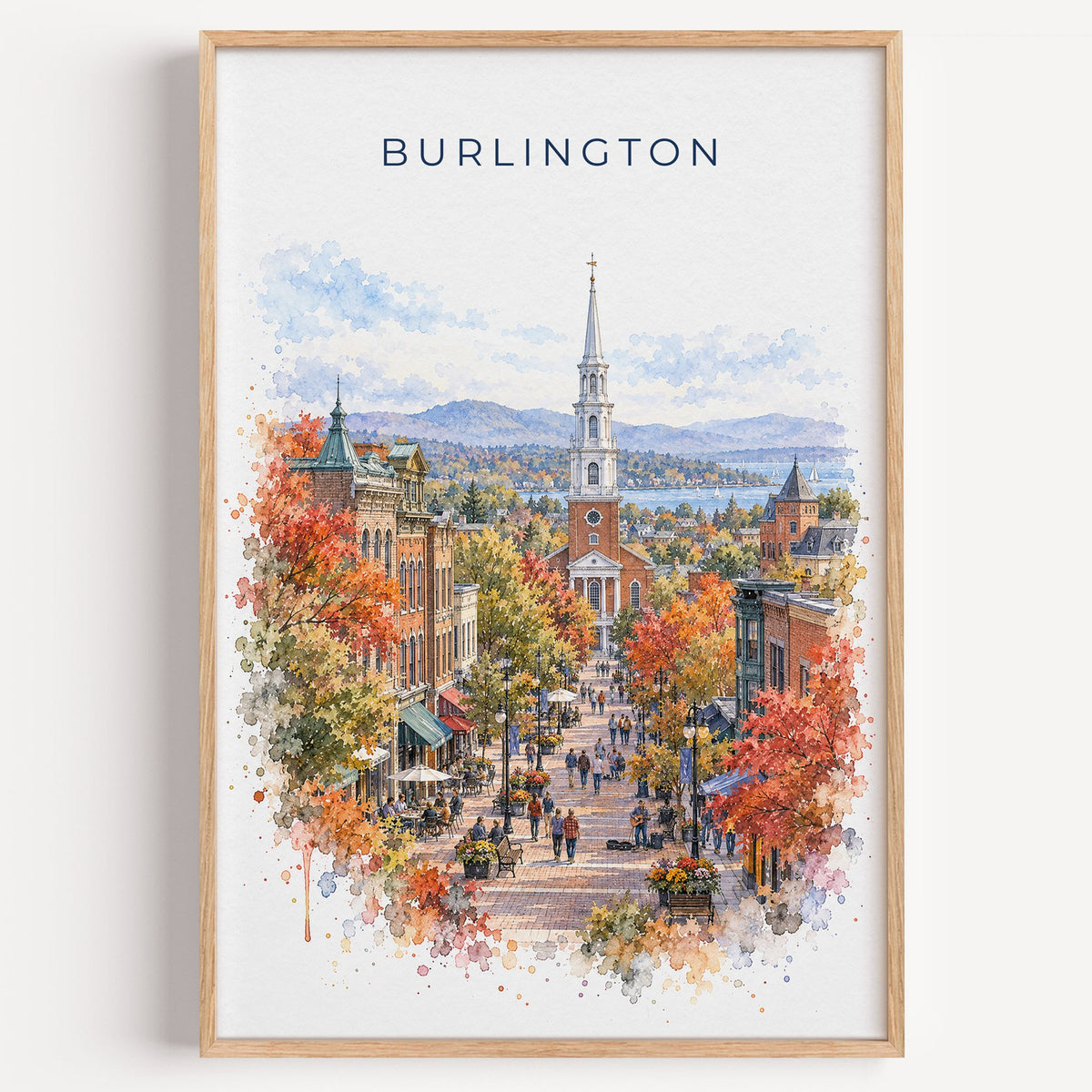 Burlington, Vermont watercolor print in a light oak frame on a plain white wall