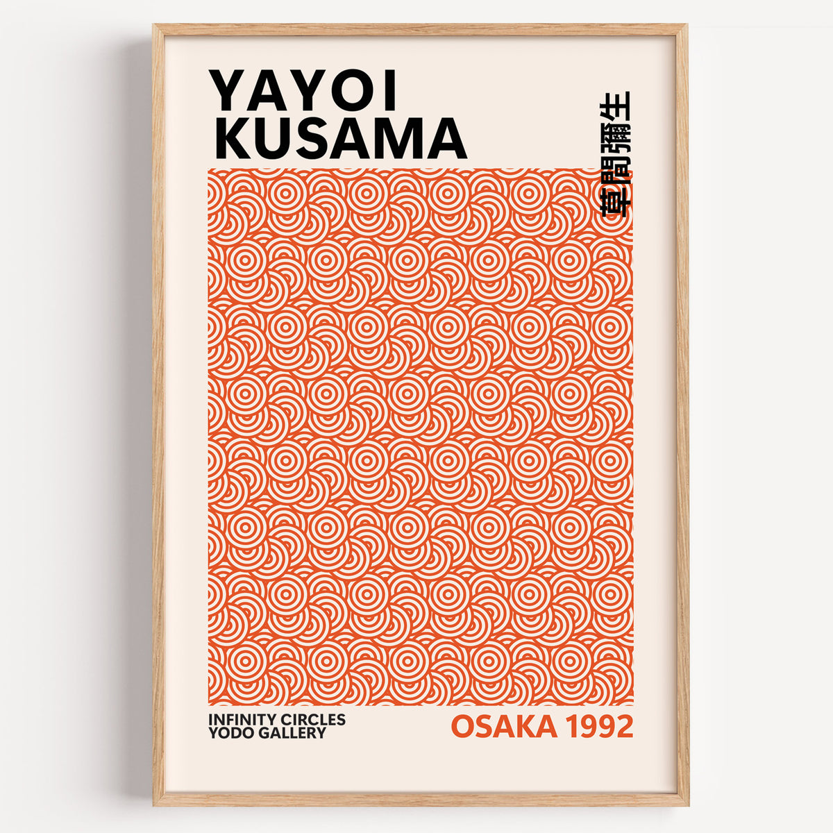 Yayoi Kusama inspired burnt orange circle print in a wood frame on a plain wall