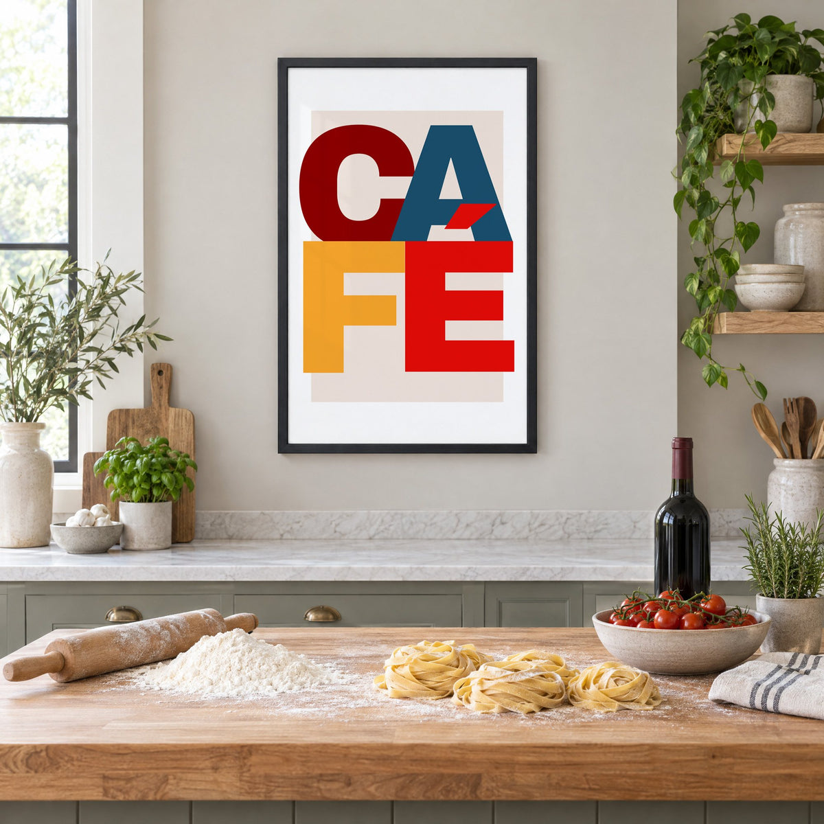 CA FÉ color block letters print in a black frame above a butcher-block island with fresh pasta, flour and cherry tomatoes