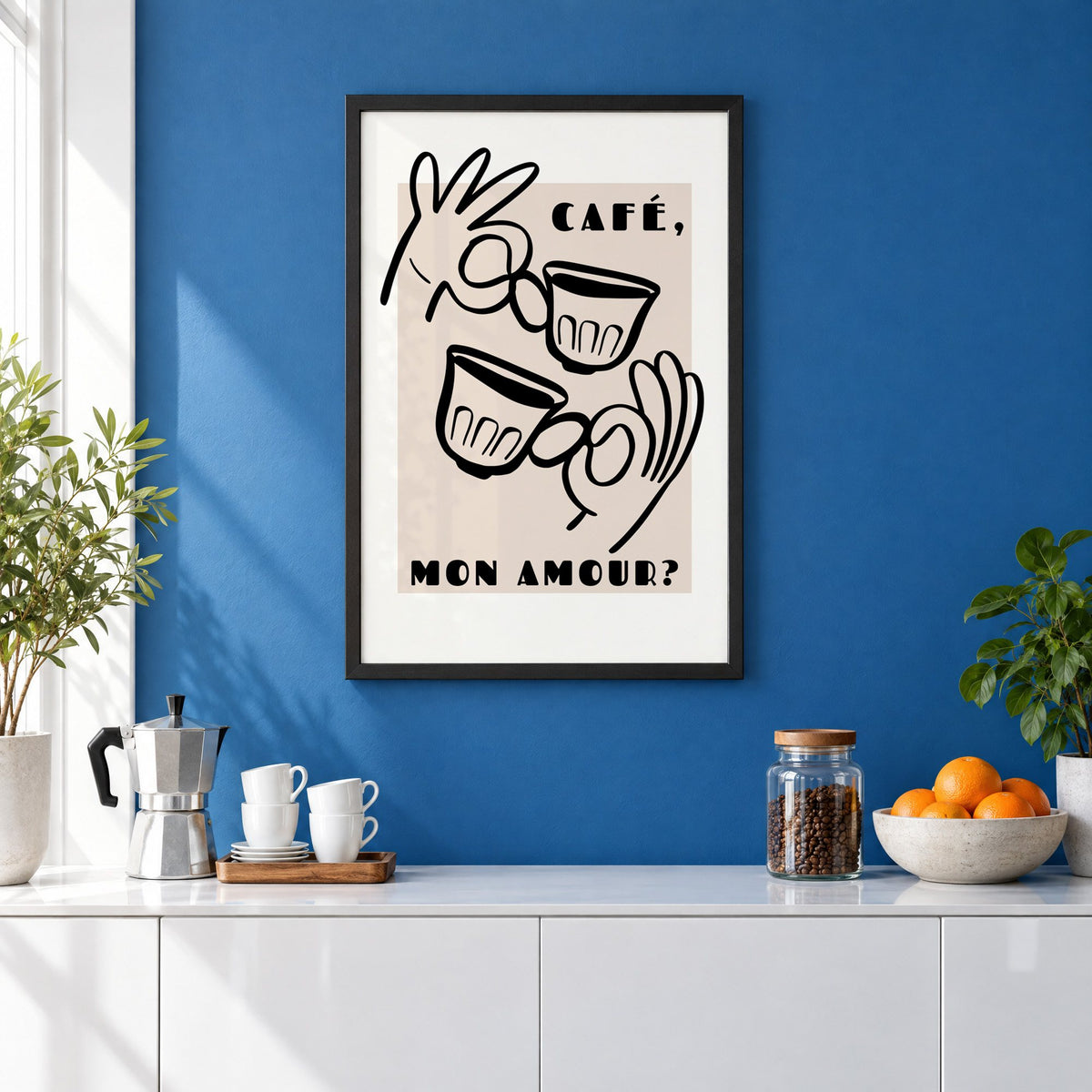 Café mon amour black line print in a black frame on a cobalt blue wall above a coffee station