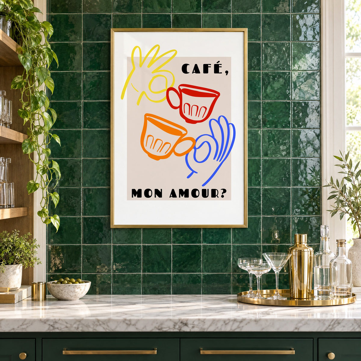 Café mon amour yellow hand beige print in a brass frame on emerald green tiles above a home bar with coupe glasses