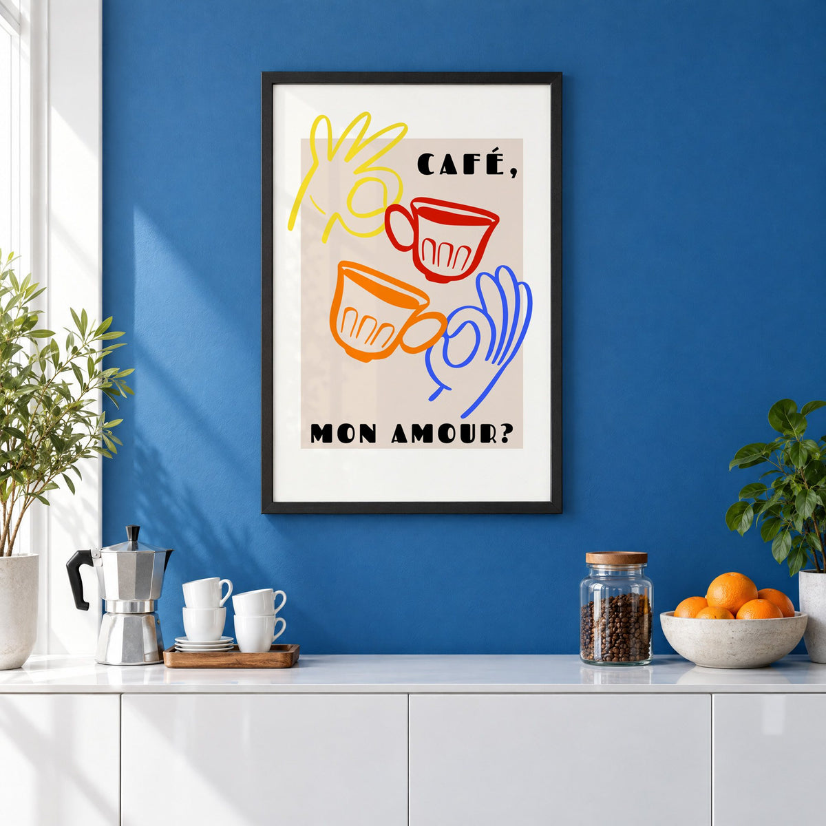 Café mon amour yellow hand beige print in a black frame on a cobalt blue wall above a coffee station