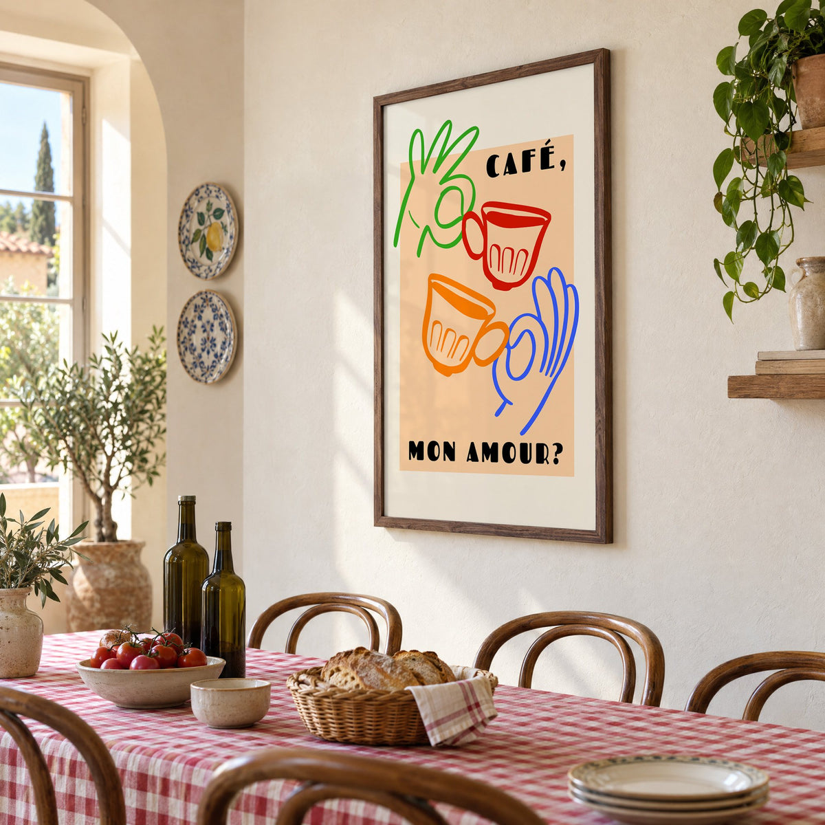 Café mon amour peach coffee cups print in a walnut frame above a gingham-covered trattoria table, seen at an angle