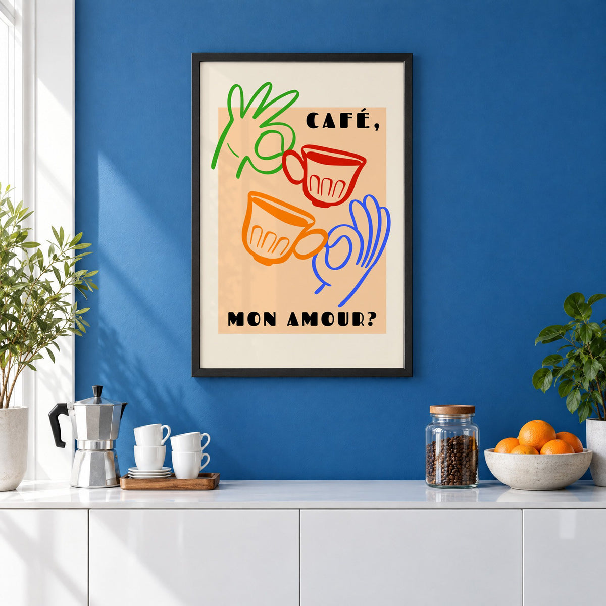 Café mon amour peach coffee cups print in a black frame on a cobalt blue wall above a coffee station